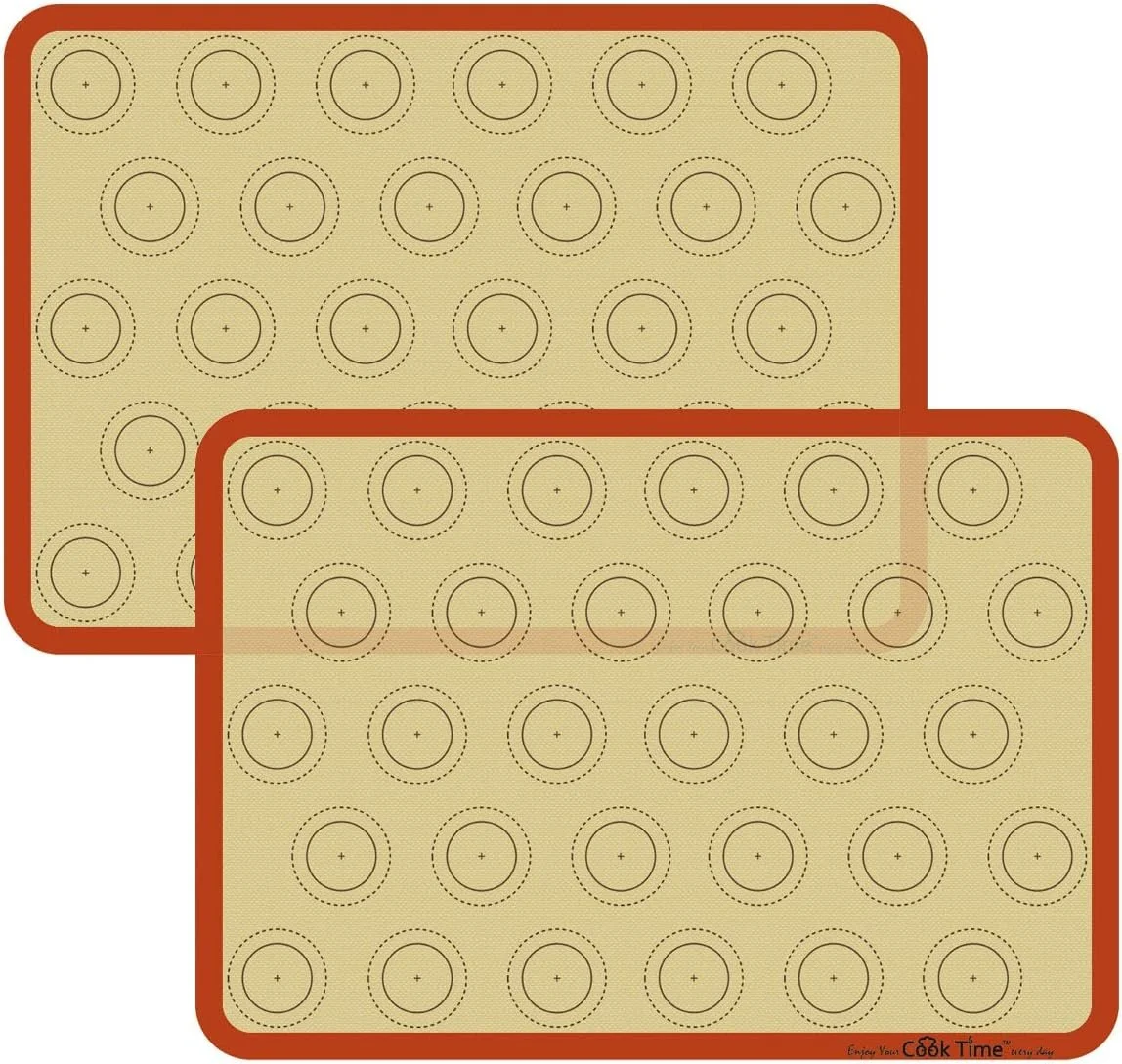 Two silicone baking mats with circular pattern markings, designed for baking cookies or similar items.