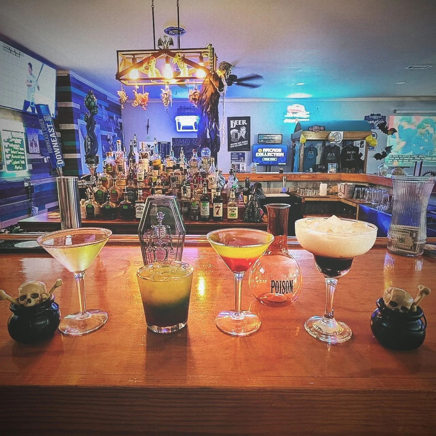 Try our Halloween Drinks! From left to right we have a Caramel Apple Martini, Fester's Trashcan, Wednesday's Poison Apple, and Morticia's Kiss.