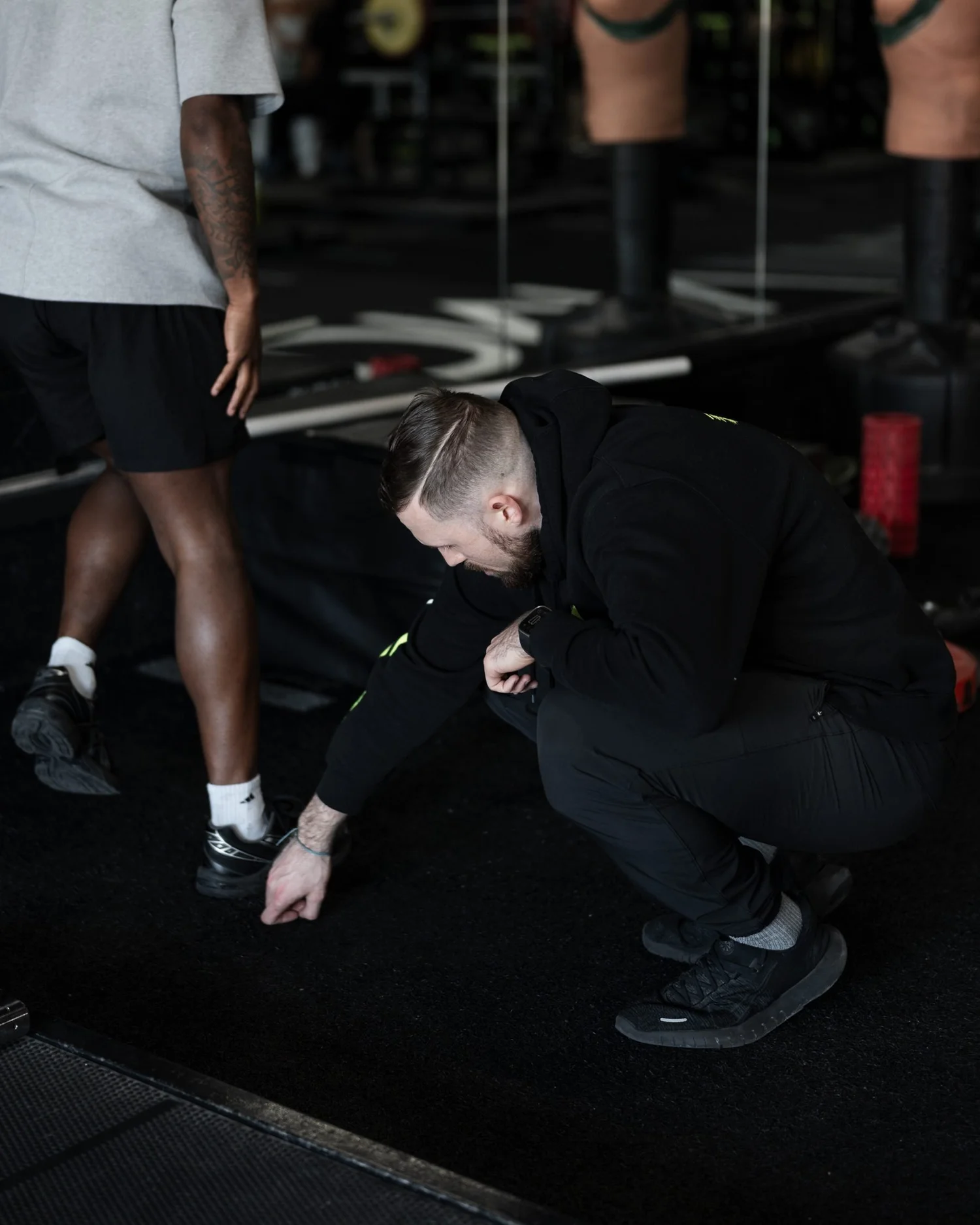 Nick Ridpath checking an athlete's foot position