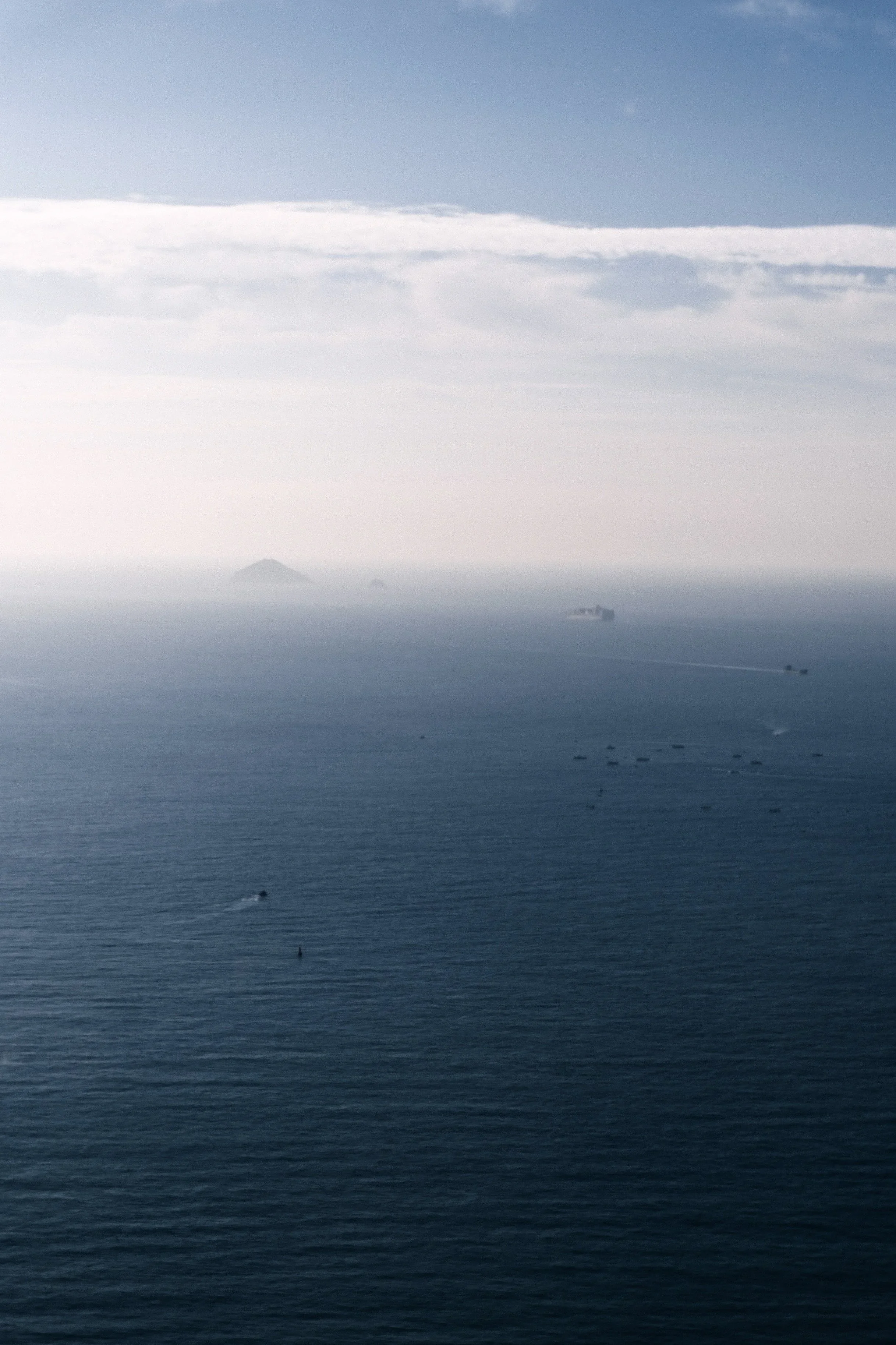 Open sea fading into a hazy sky