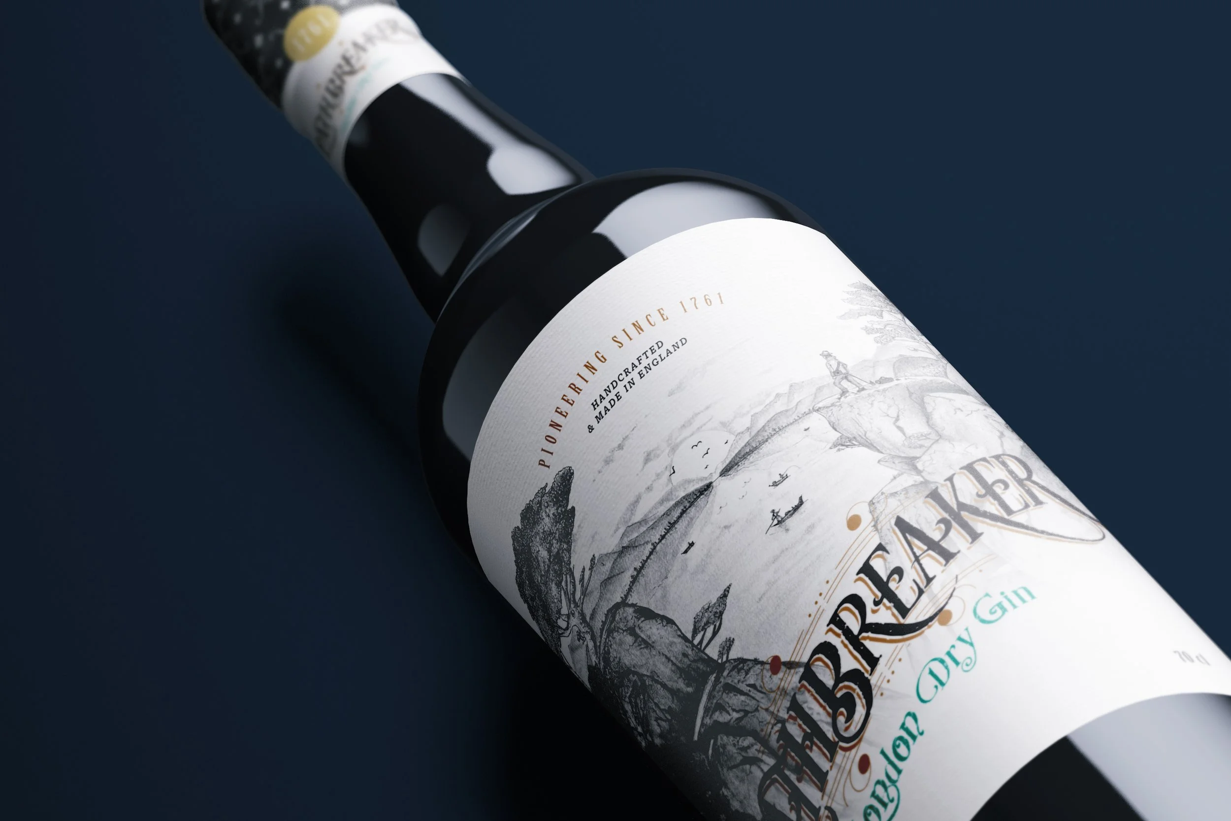 A black bottle of London Dry Gin lying on a dark surface. The label features an artistic sketch of a coastal scene with boats and figures, and text indicating it is handcrafted in England since 1761.