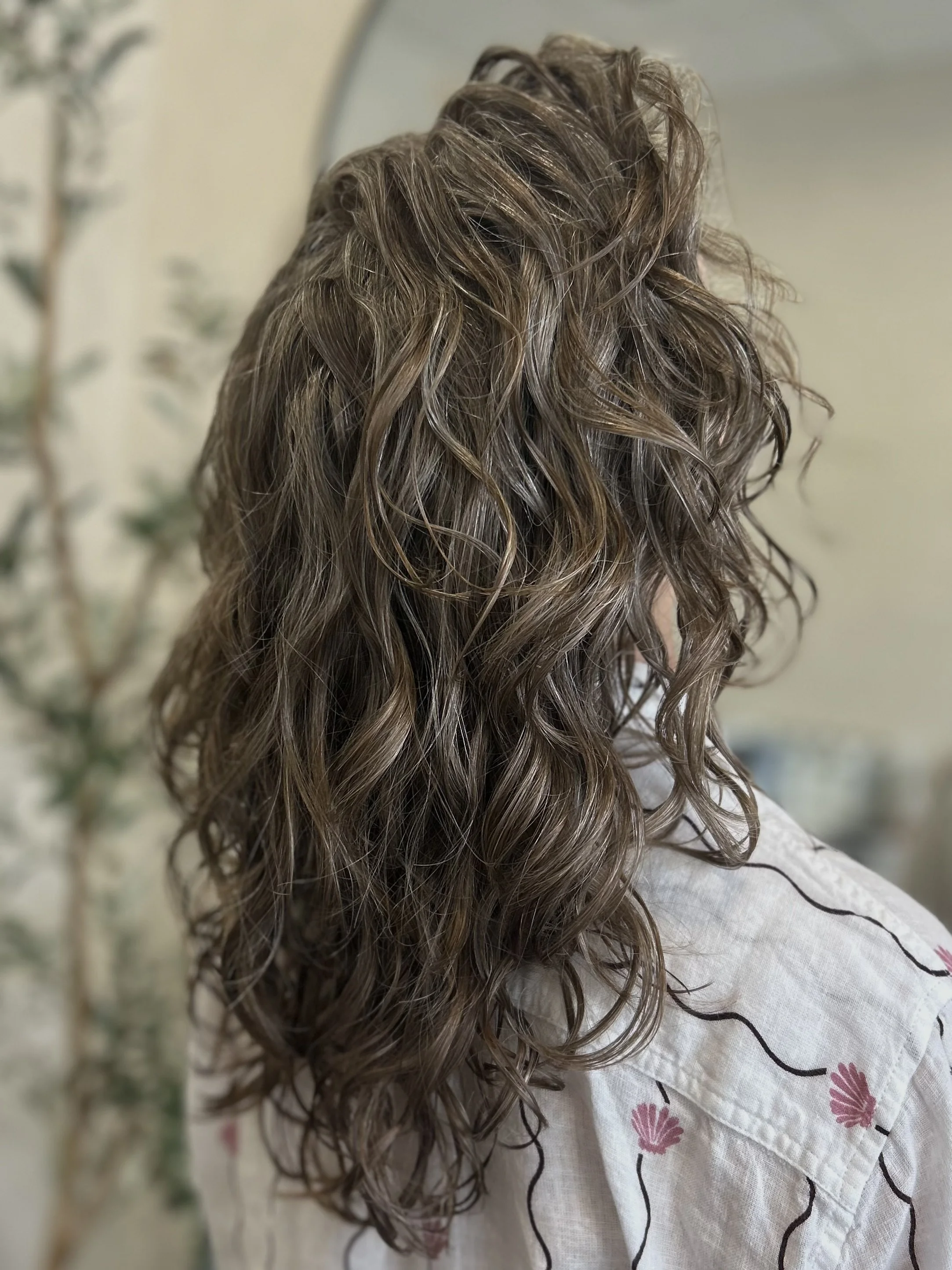 Long curly cut on loose waves in Sarasota 