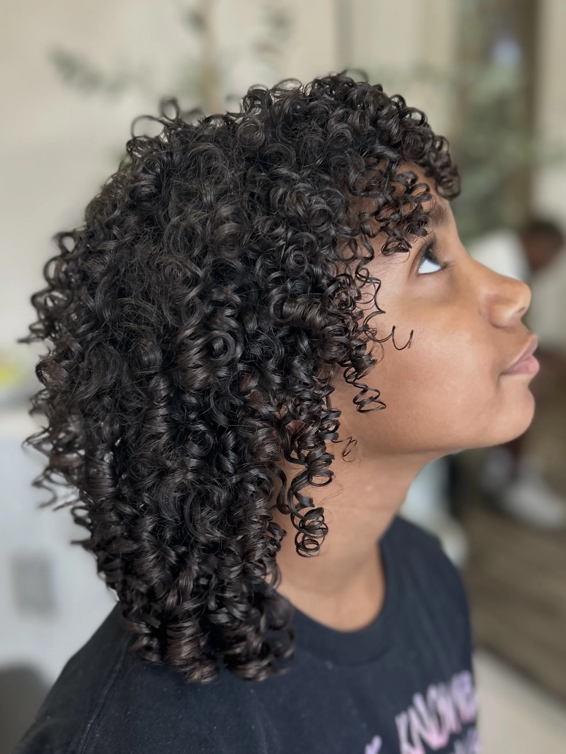 image of medium length brown curly hair styled at my curly hair in salon sarasota