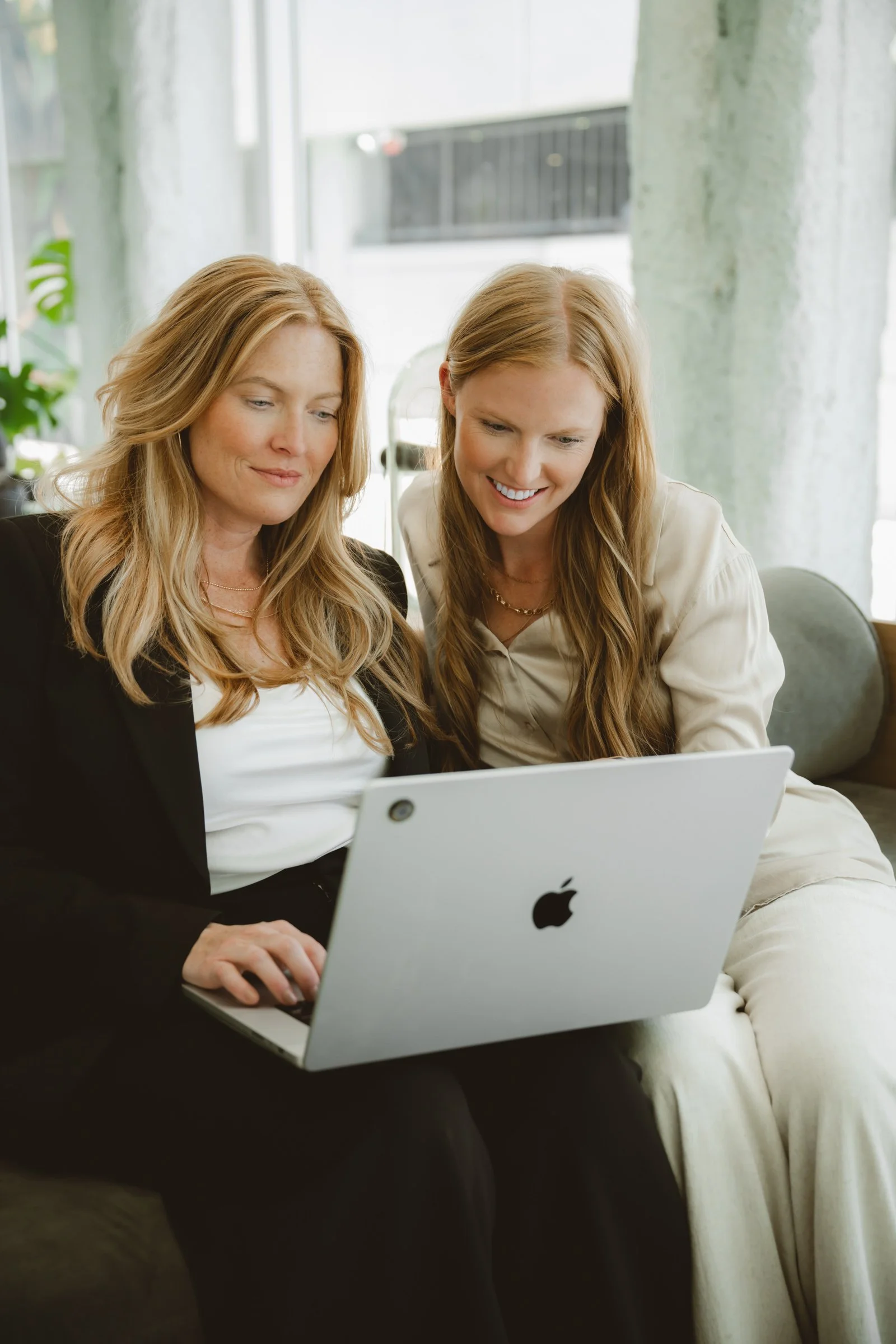 Orthodontic consultant Courtney Gutierrez working on a laptop in a clean and modern office