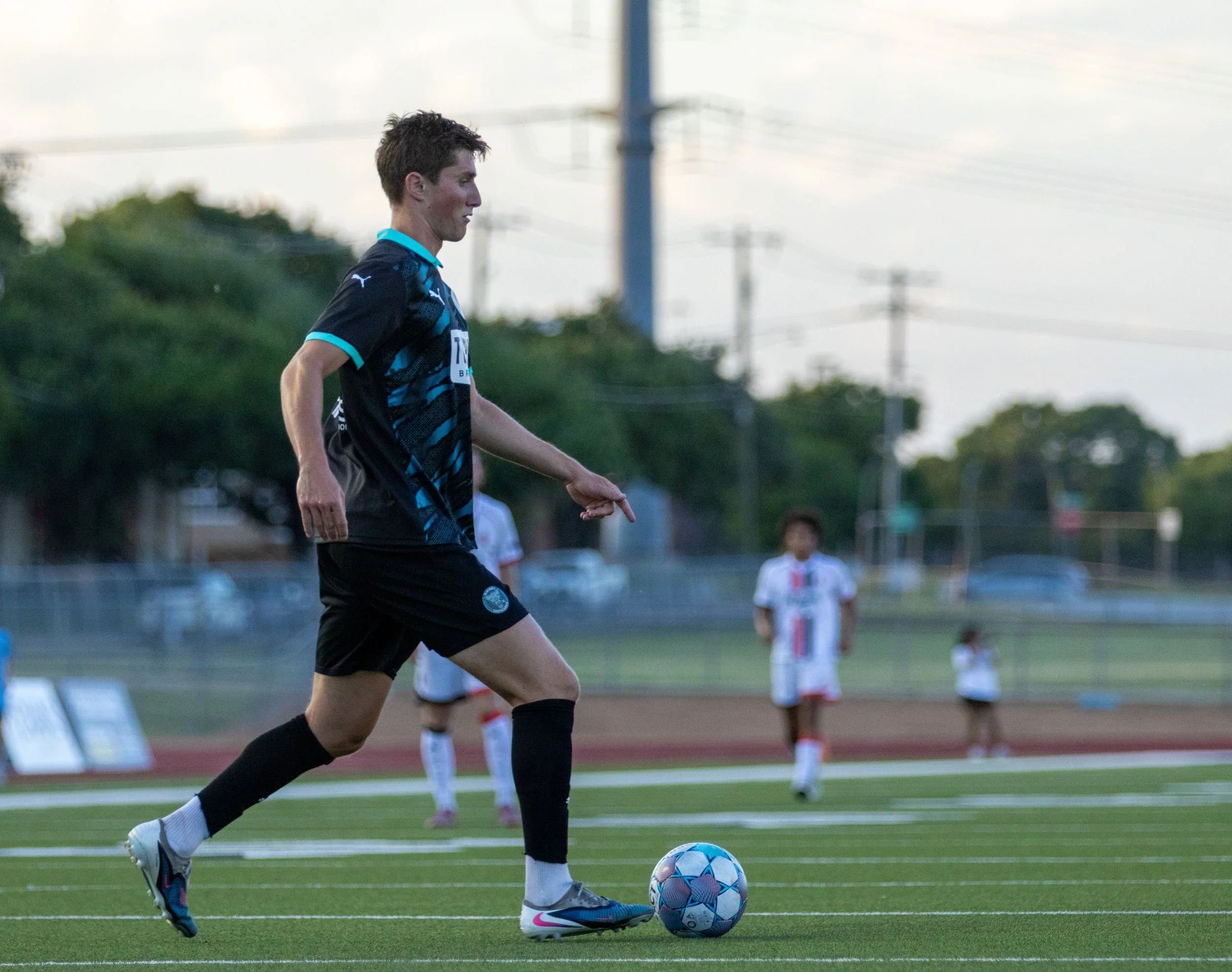 McKinney Chupacabras FC defender Luke Adams controls the ball during a training session in McKinney, Texas.