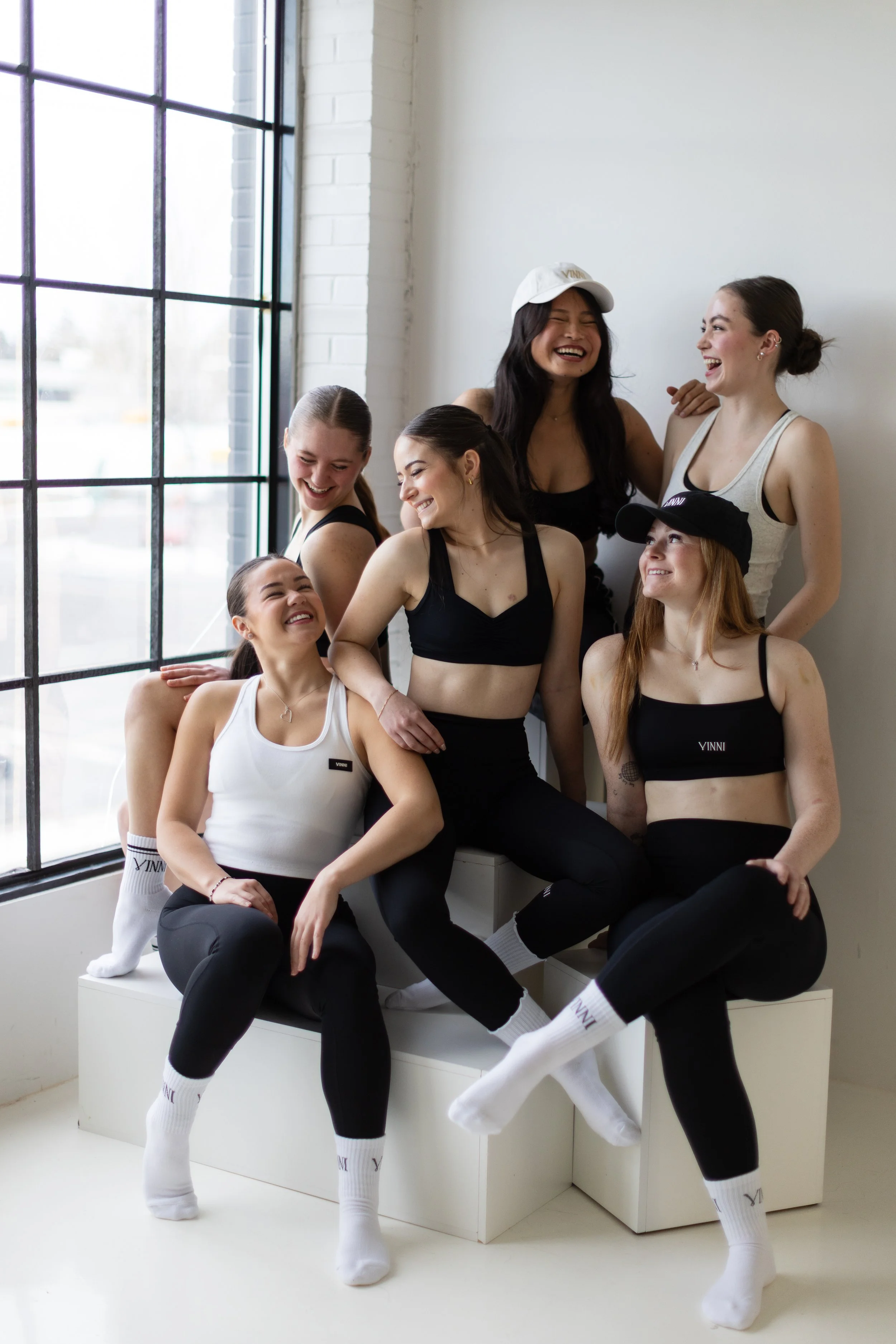 TrueWest models posed in Vinni THE Label items