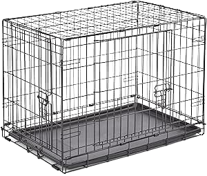Empty metal wire dog crate with a plastic bottom tray.