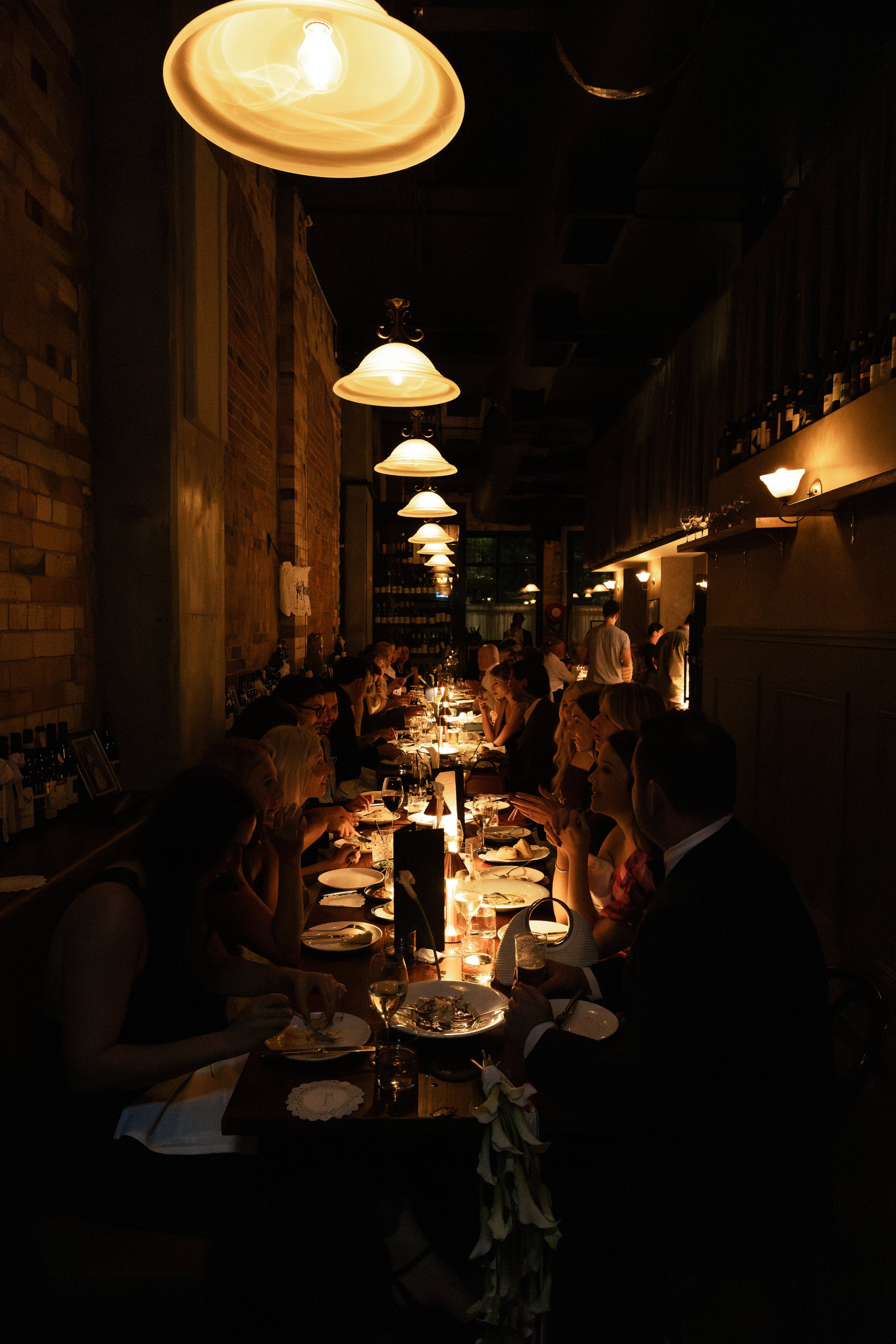 Indoor restaurant dining room at Rosmarino, Fortitude Valley — moody candlelit setting for group events and weddings
