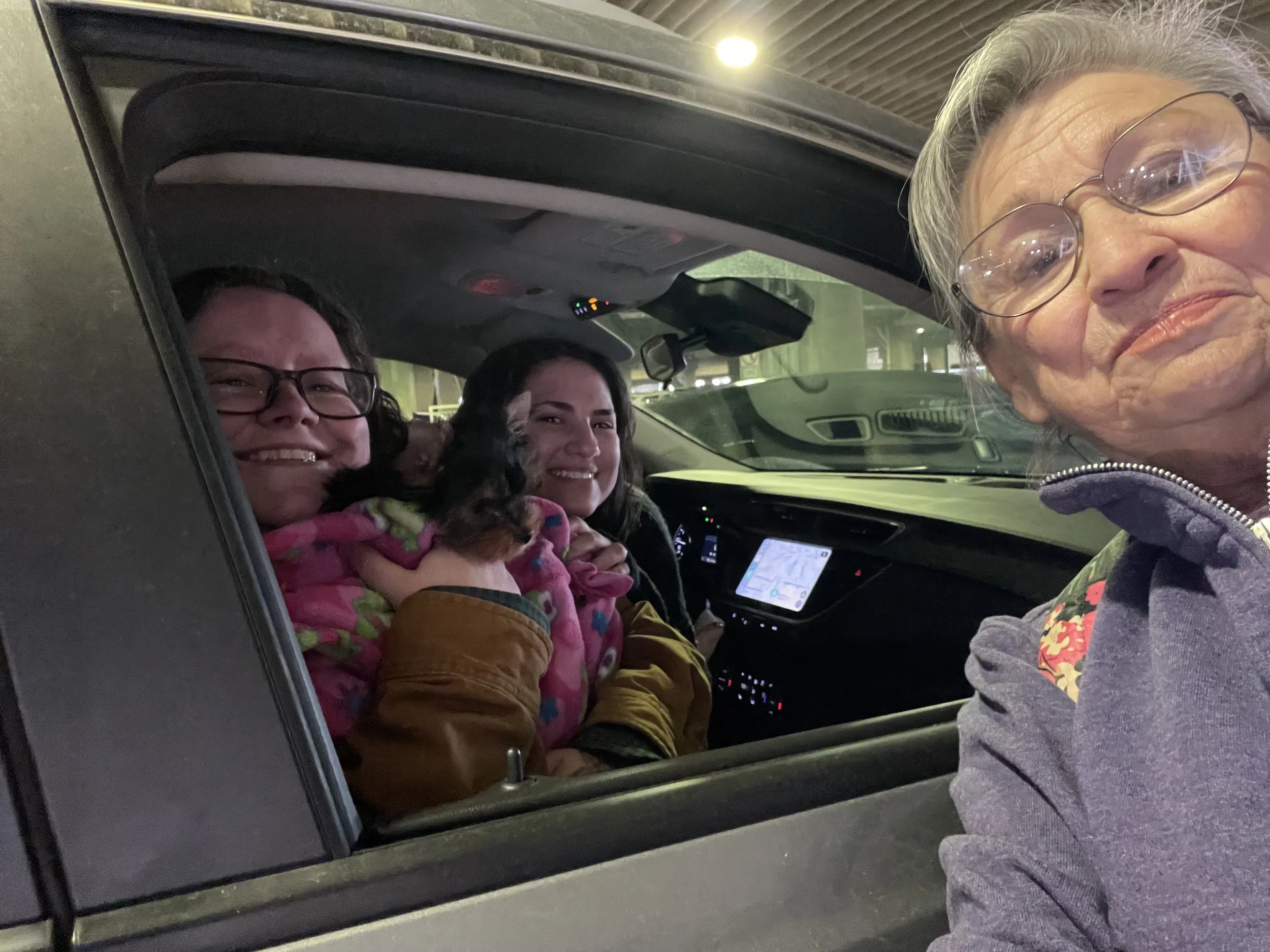 Flight nanny completing in-person pet delivery to new owners after safe in-cabin transport.