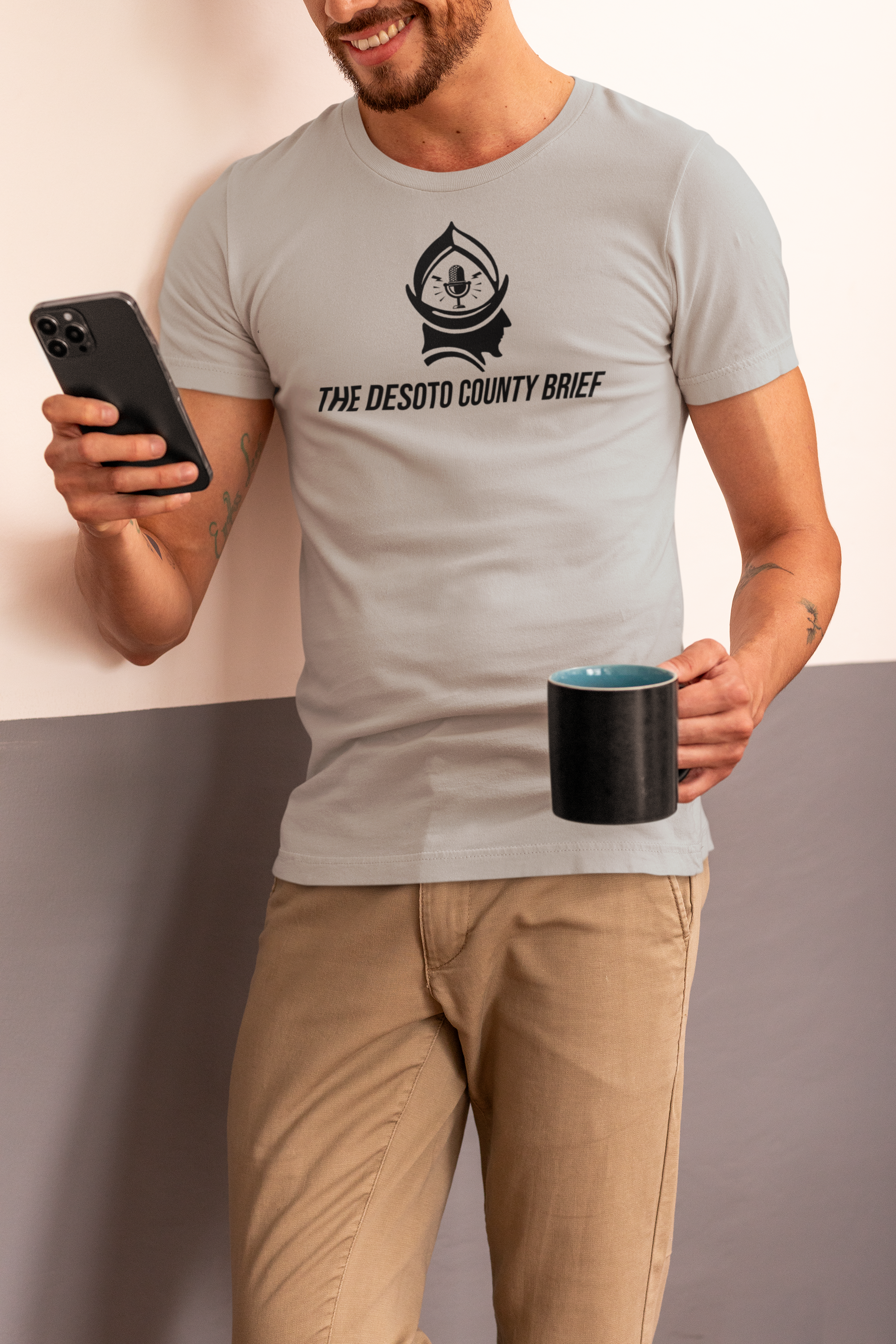 bella-canvas-tee-mockup-of-a-smiling-cropped-face-man-checking-his-phone-m50062.png