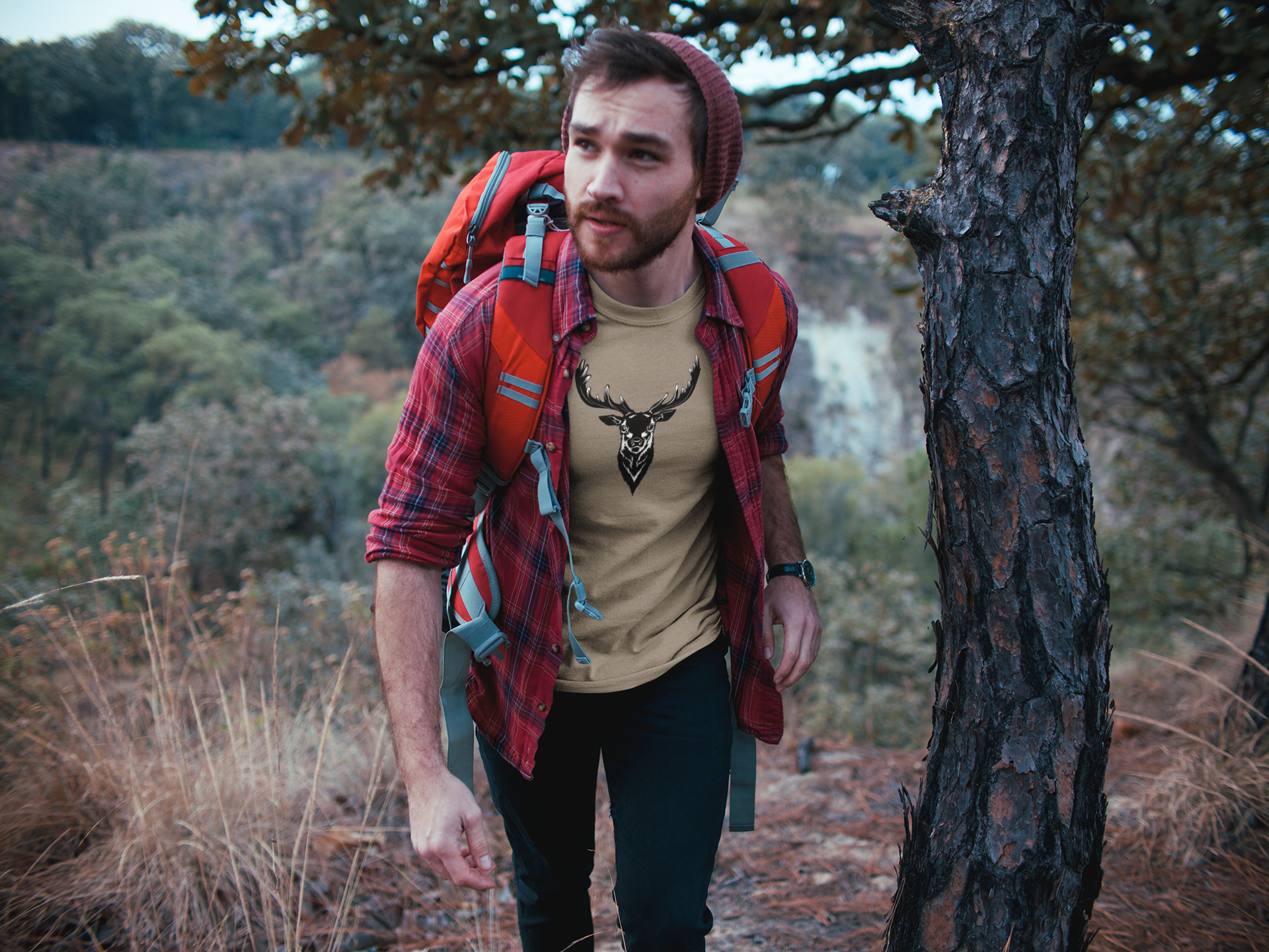 man-wearing-a-tshirt-mockup-trekking-at-the-mountains-a19036.png