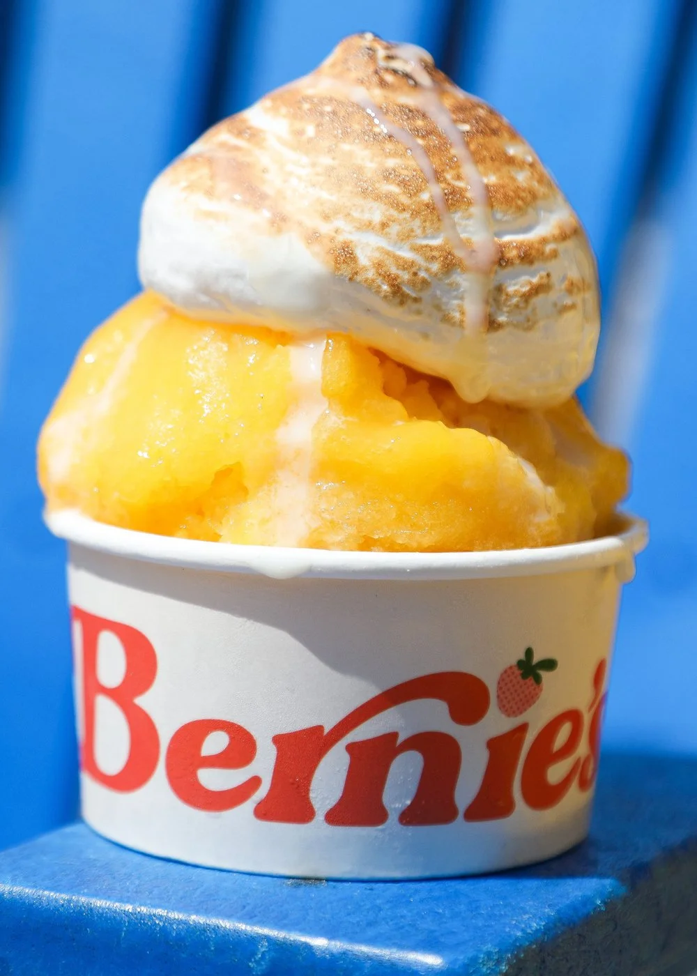 A cup of Bernie&rsquo;s mango Italian ice with torched meringue