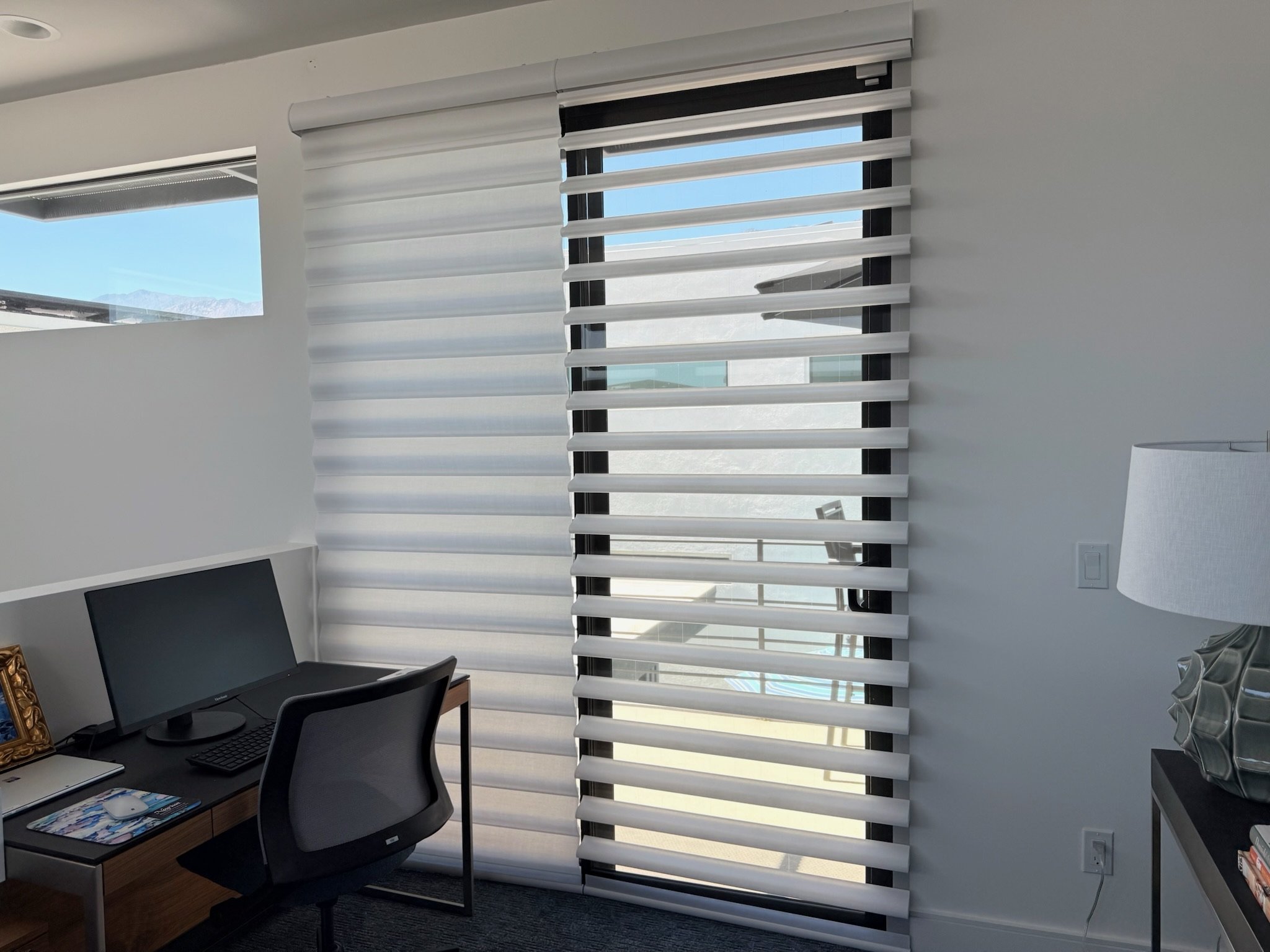 Hunter Douglas Pirouette Shades on a sliding door in Palm Springs