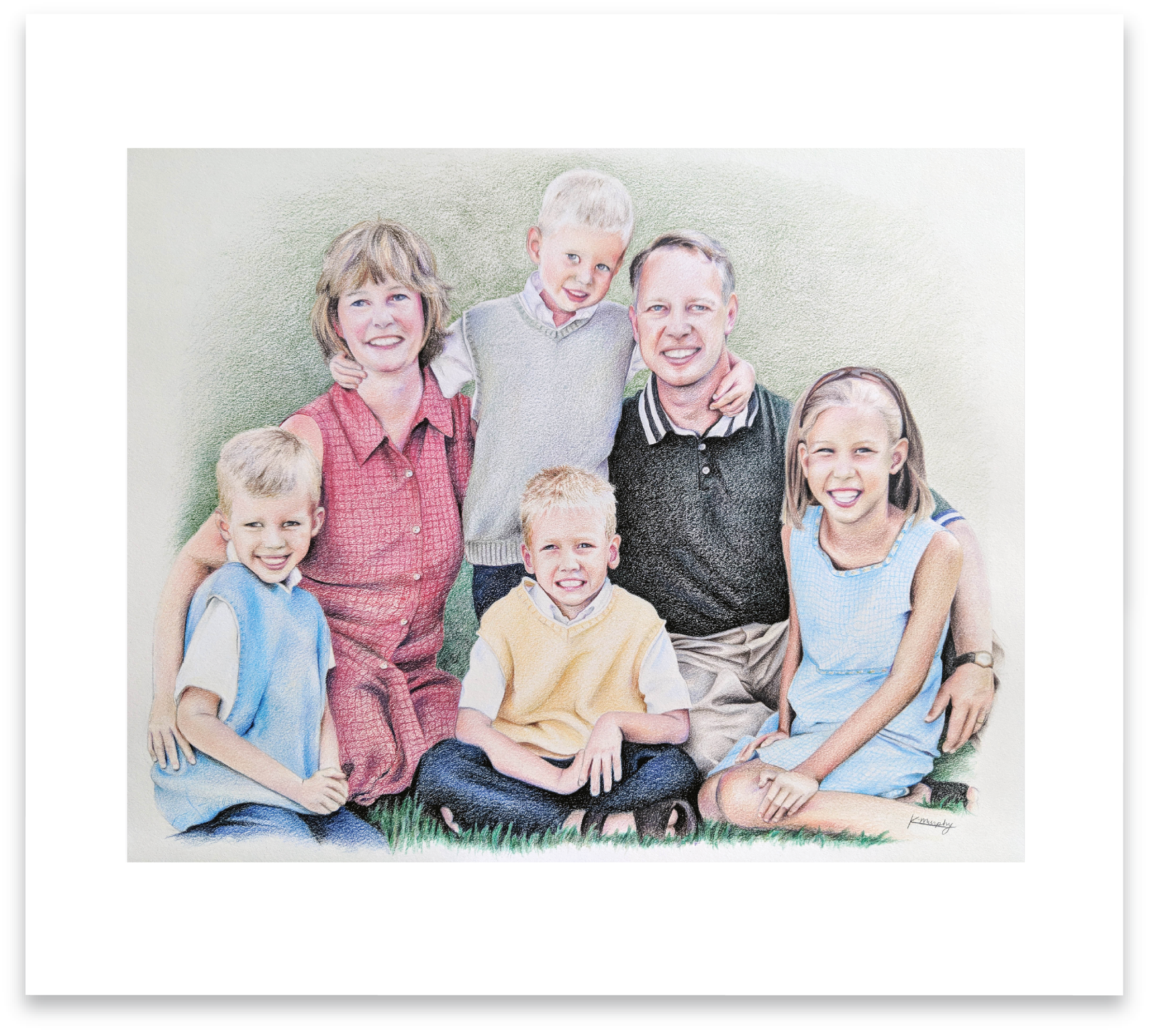 Colorful family portrait of two parents and four children sitting on grass.