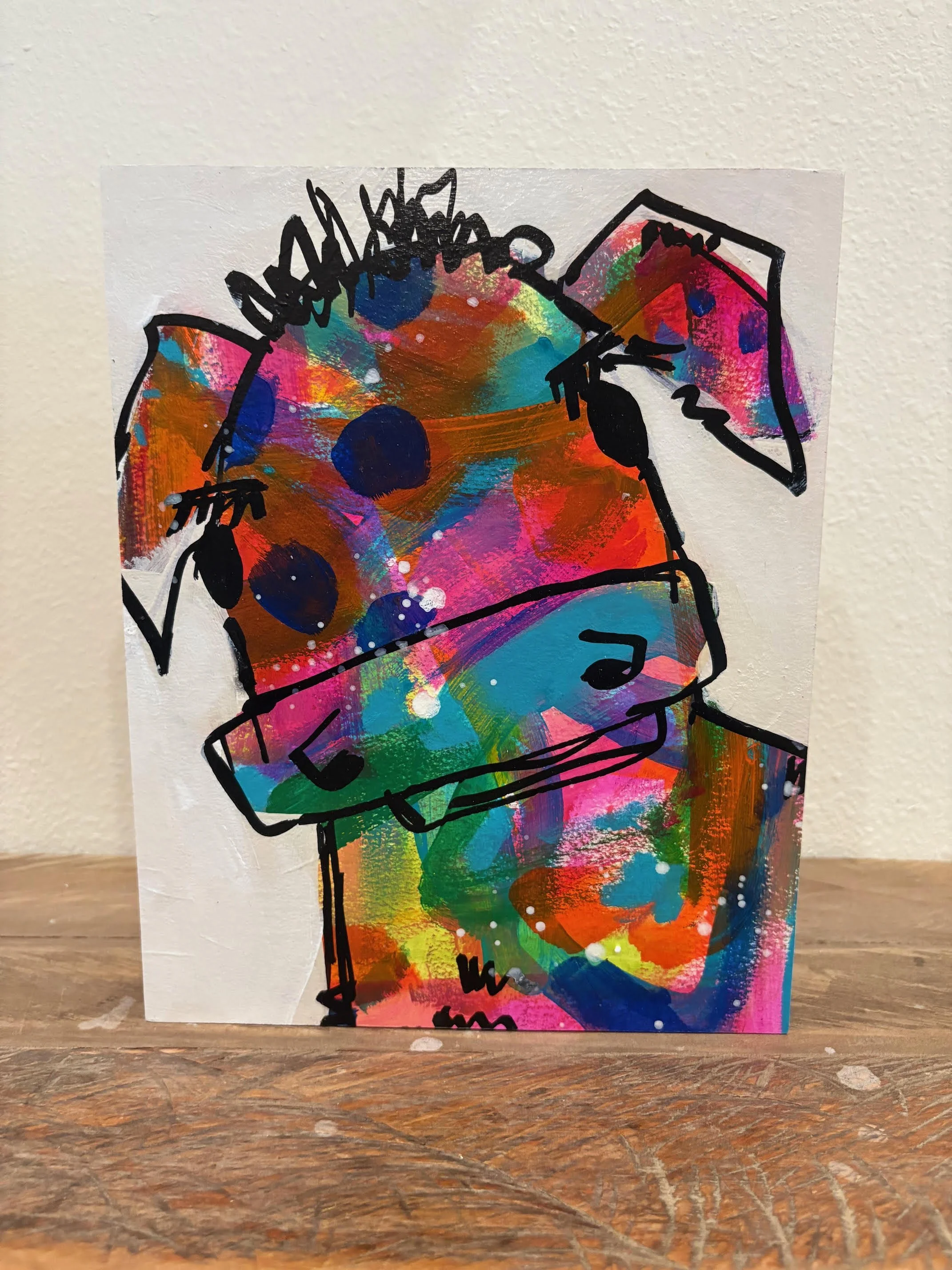 a colorful cartoon cow painting