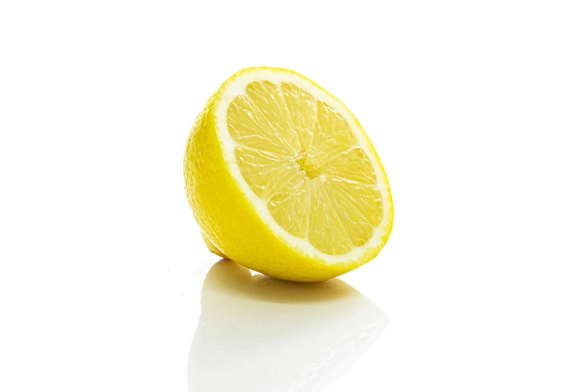 Half a lemon on white background