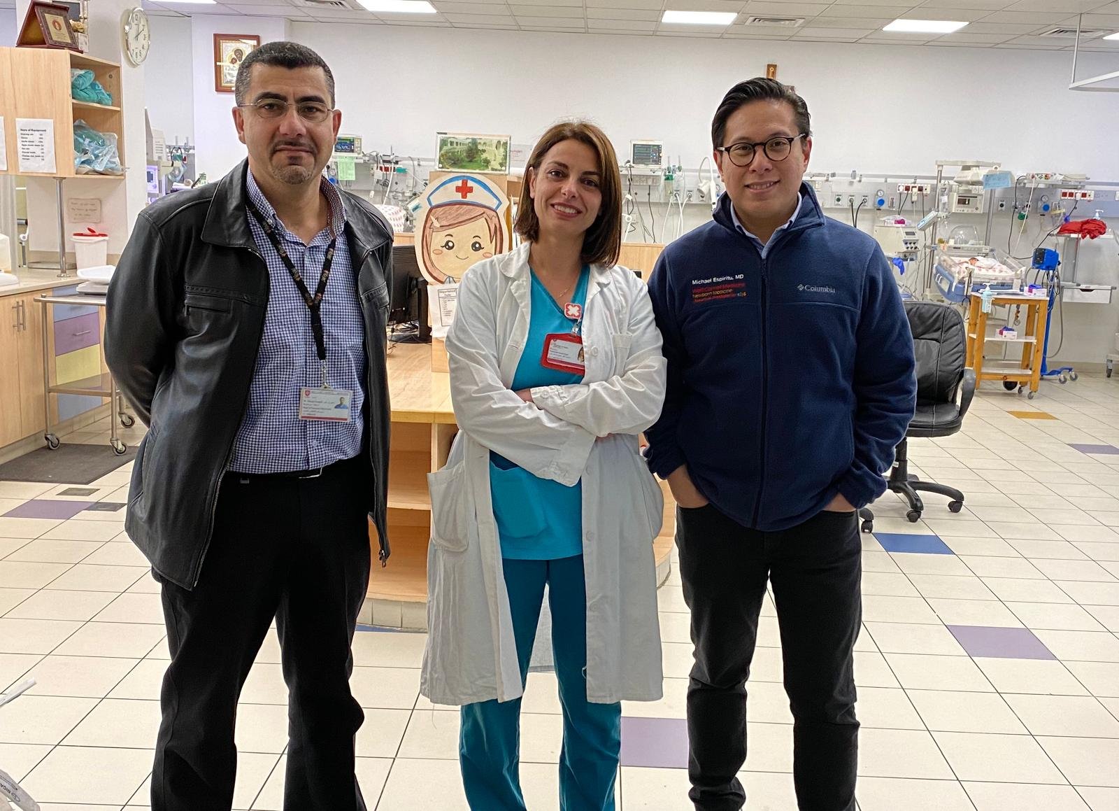 Committee member and Ball founder Dr. Michael Espiritu visiting with providers at the Hospital.