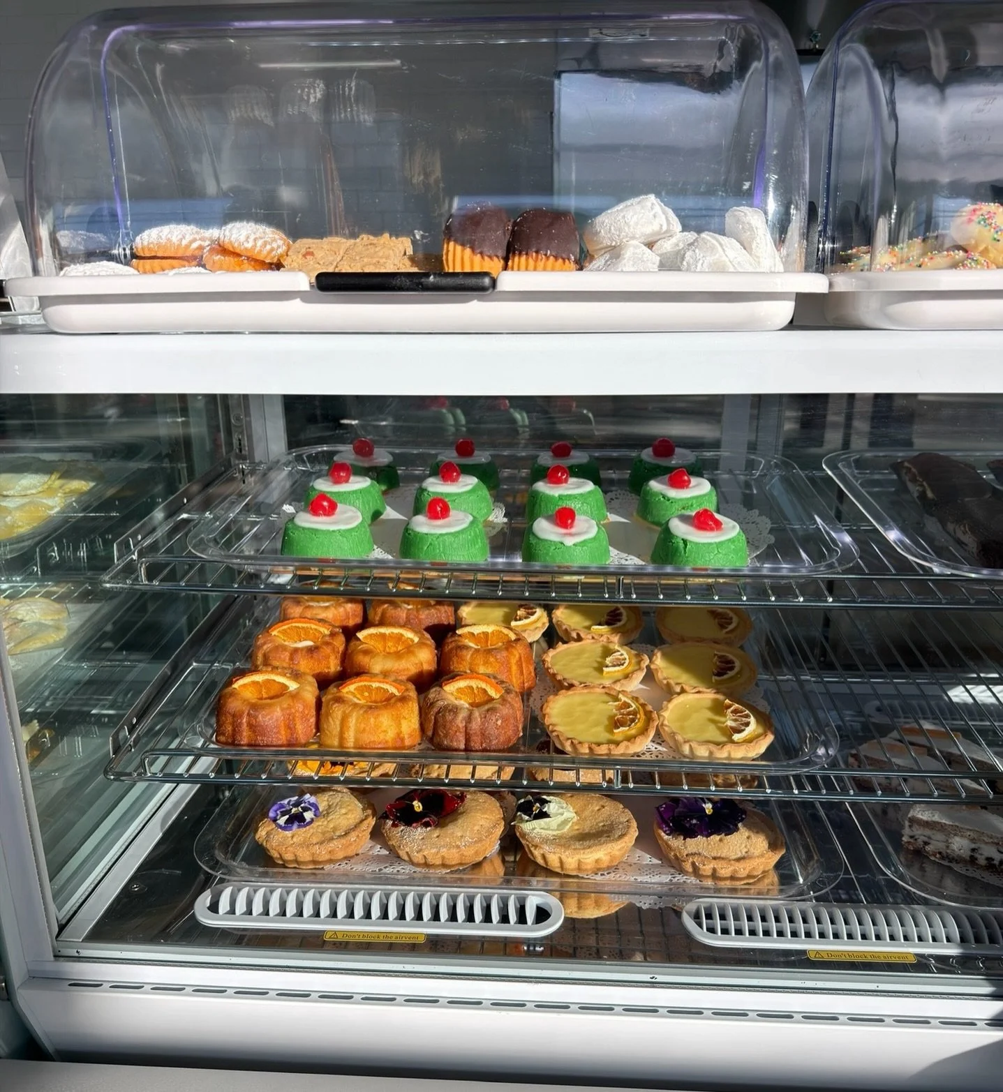 Made fresh every morning. Gone by afternoon.

The first bite of a cassatine: pistachio-green marzipan giving way to soft sponge. Almond cookies. Powdered-sugar cookies dusted snow-white. Bright citrus tarts. Orange-glazed little cakes. Tartlets crown