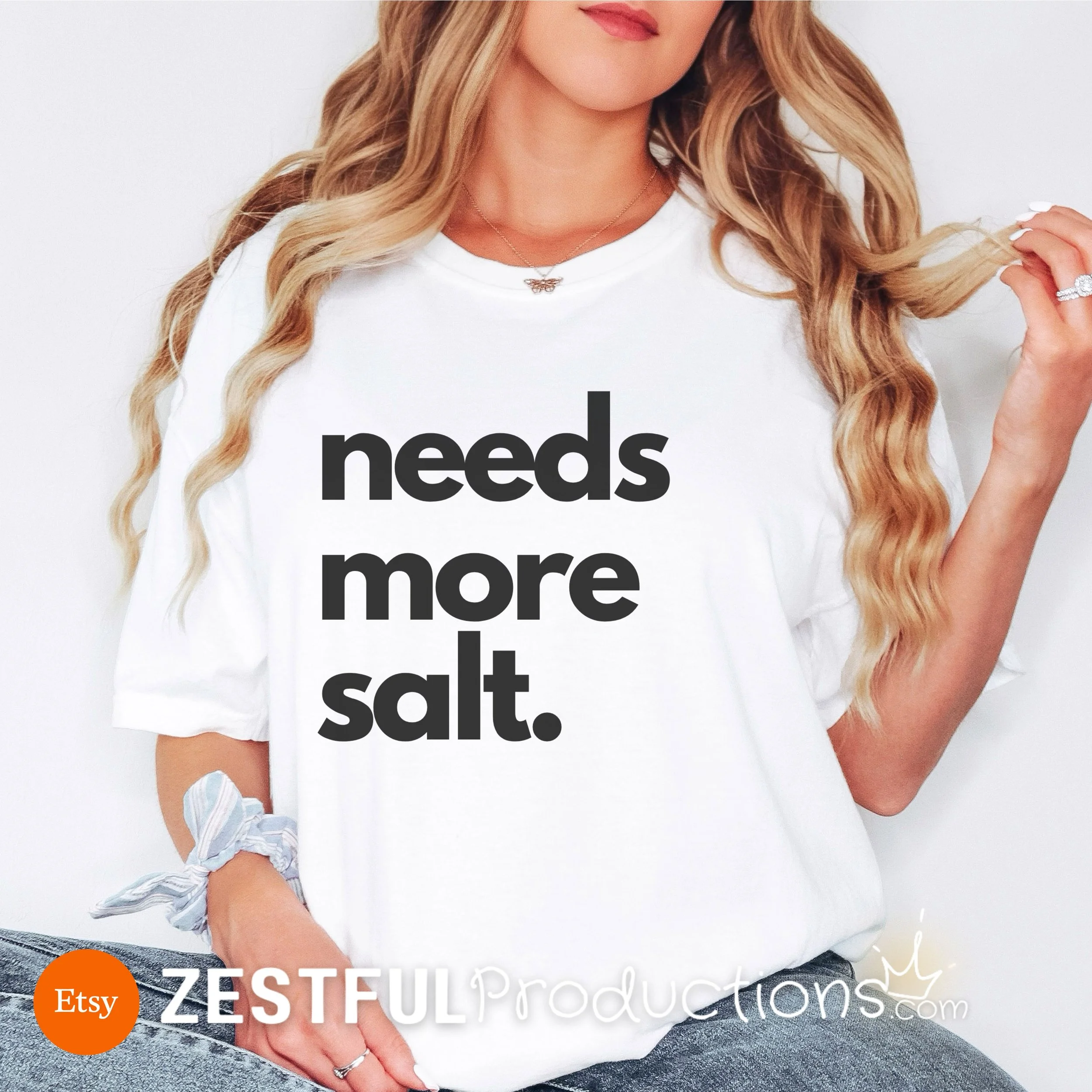 Classic white Comfort Colors tee with bold black ‘Needs More Salt’ design – unisex sarcastic foodie t-shirt.
