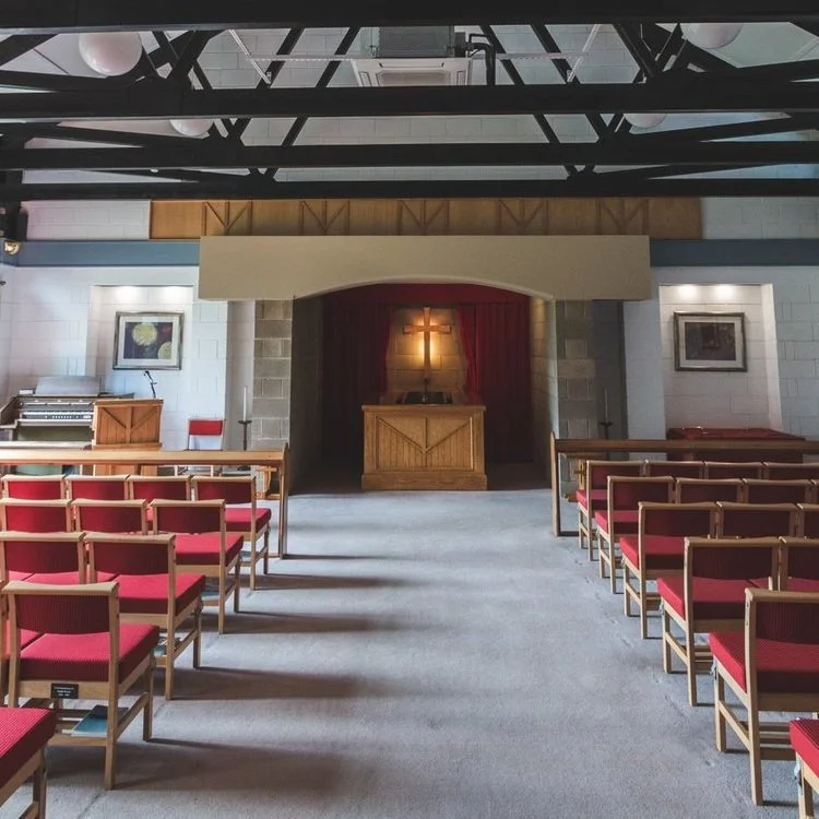 Seating and the central aisle inside the chapel at Parkgrove Crematorium