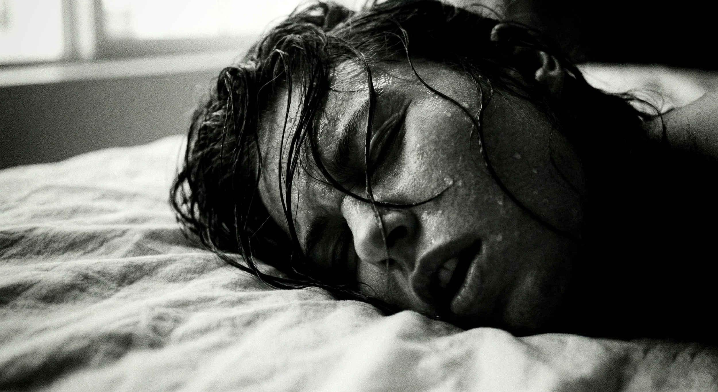 black and white sweaty young woman feeliong the climax