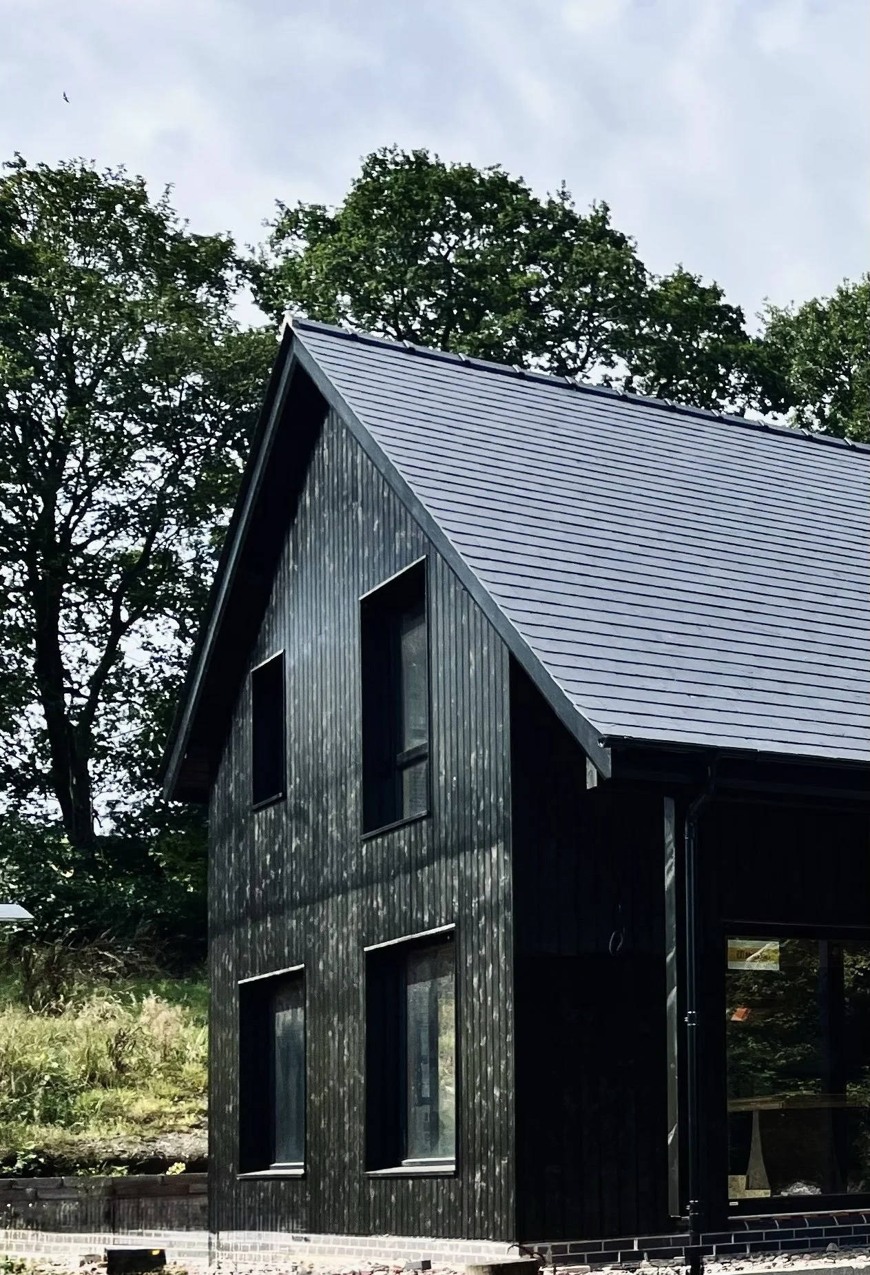 ty cefn builders, heat treated black cladding, nordan windows and slate roof, wales, oswestry