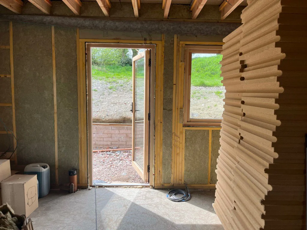 Lime green woodfibre insulation installers in Wales. Builders using natural materials in mid wales near welshpool and shrewsbury.