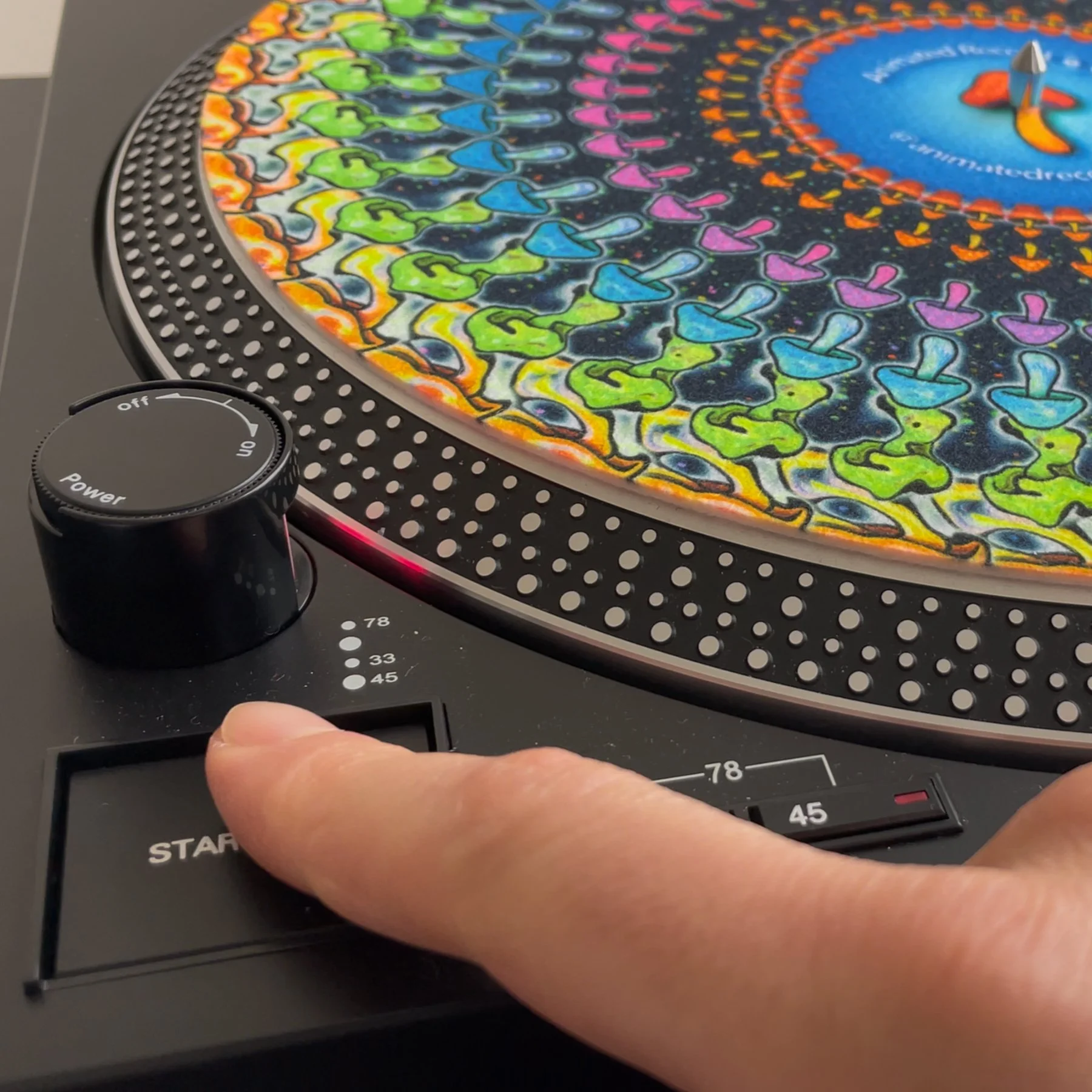 finger turning on turntable.