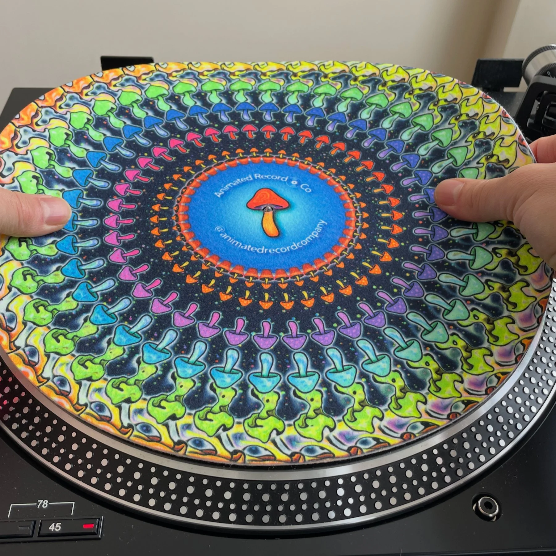 slipmat being placed on turntable.