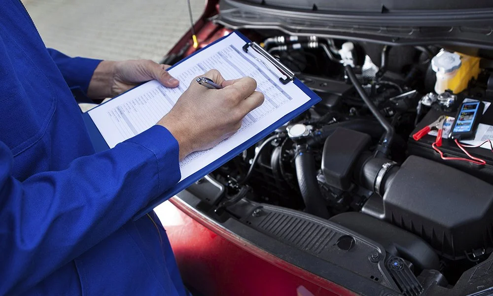 Photo of inspection technician holding a clipboard