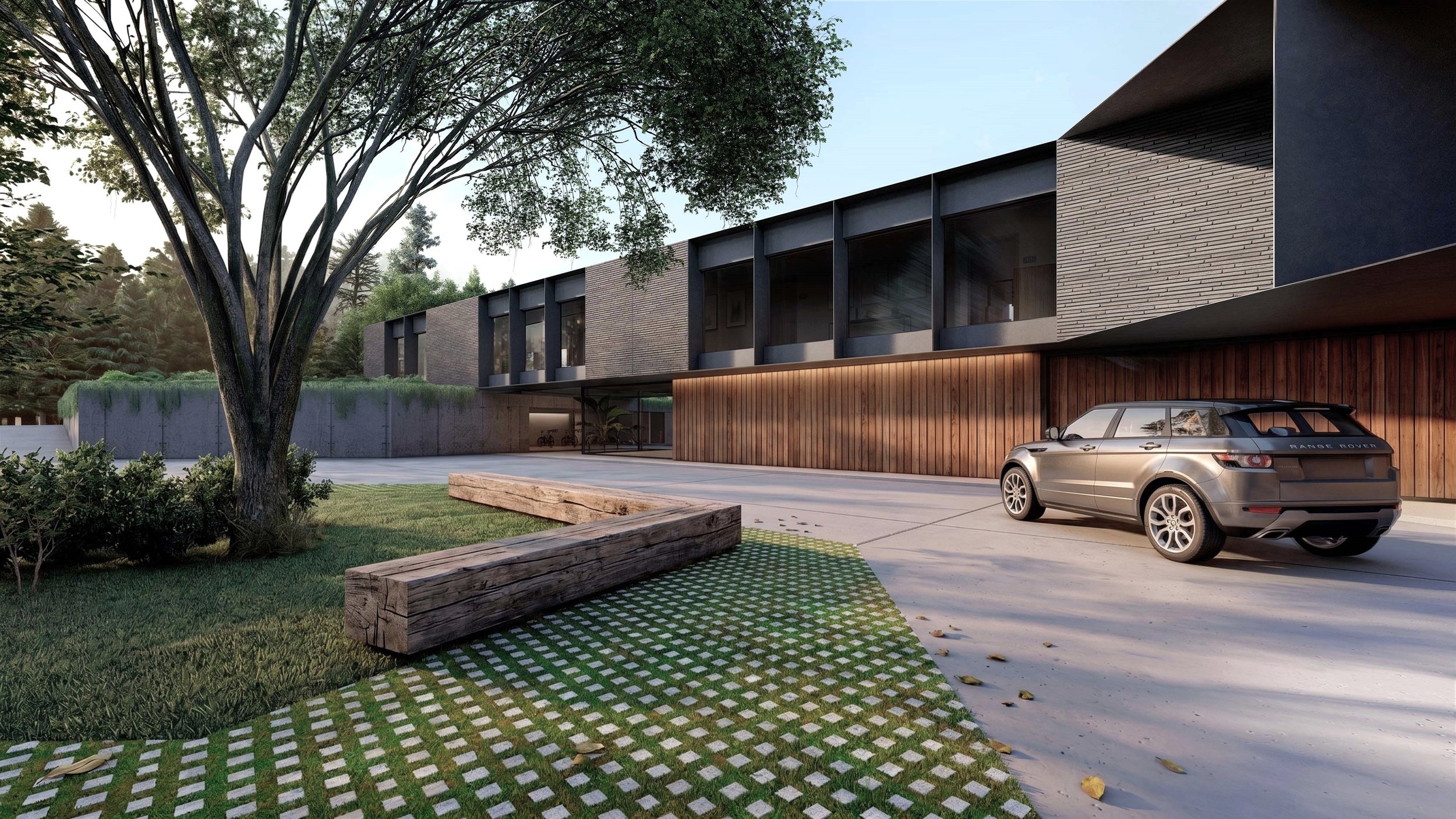 Vista de una casa moderna con estacionamiento y coche Range Rover en primer plano, rodeada de árboles y áreas verdes.