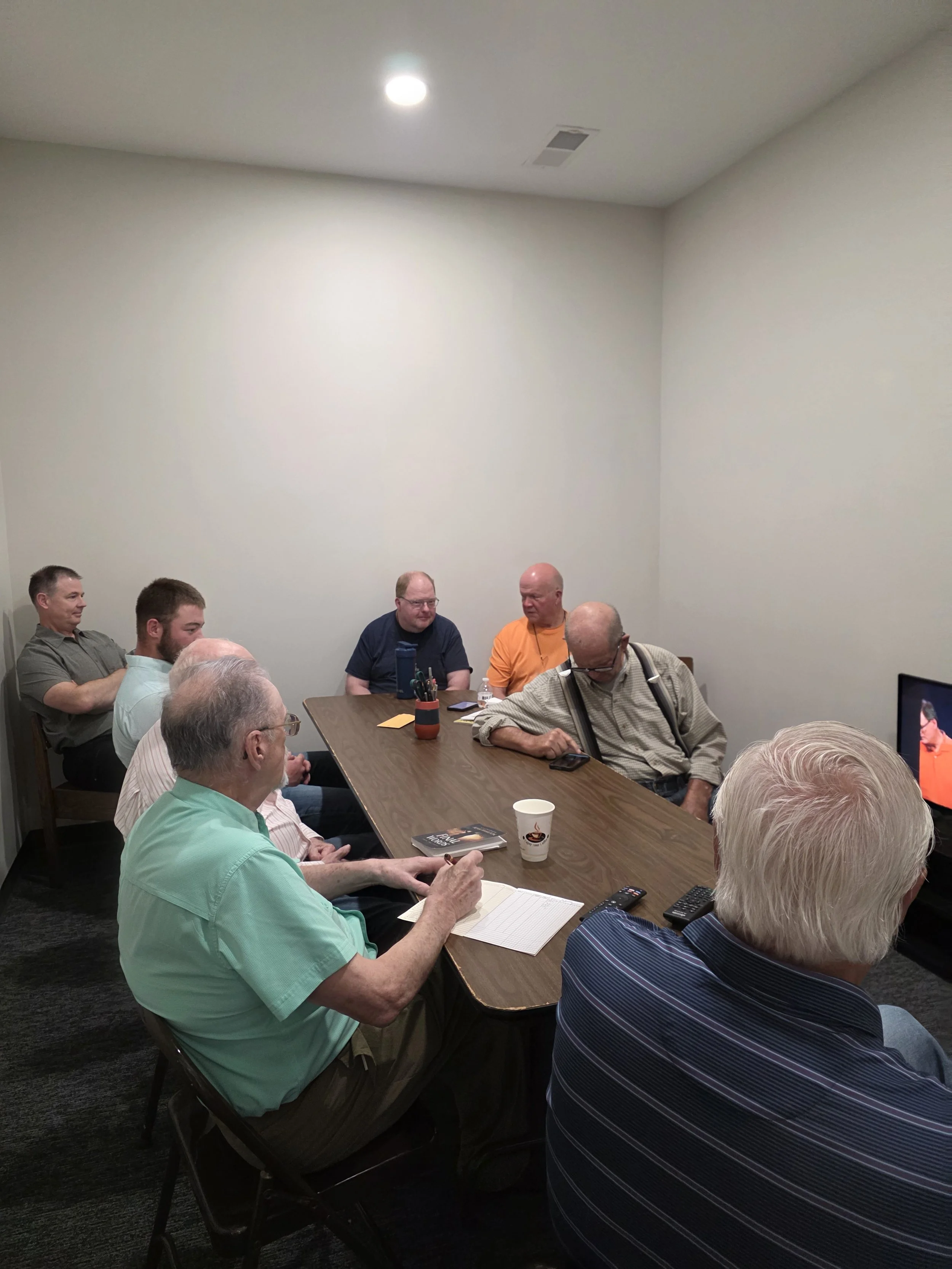 Men's Sunday School group gathered around a table at Lexington First United Methodist Church in Lexington, Illinois.