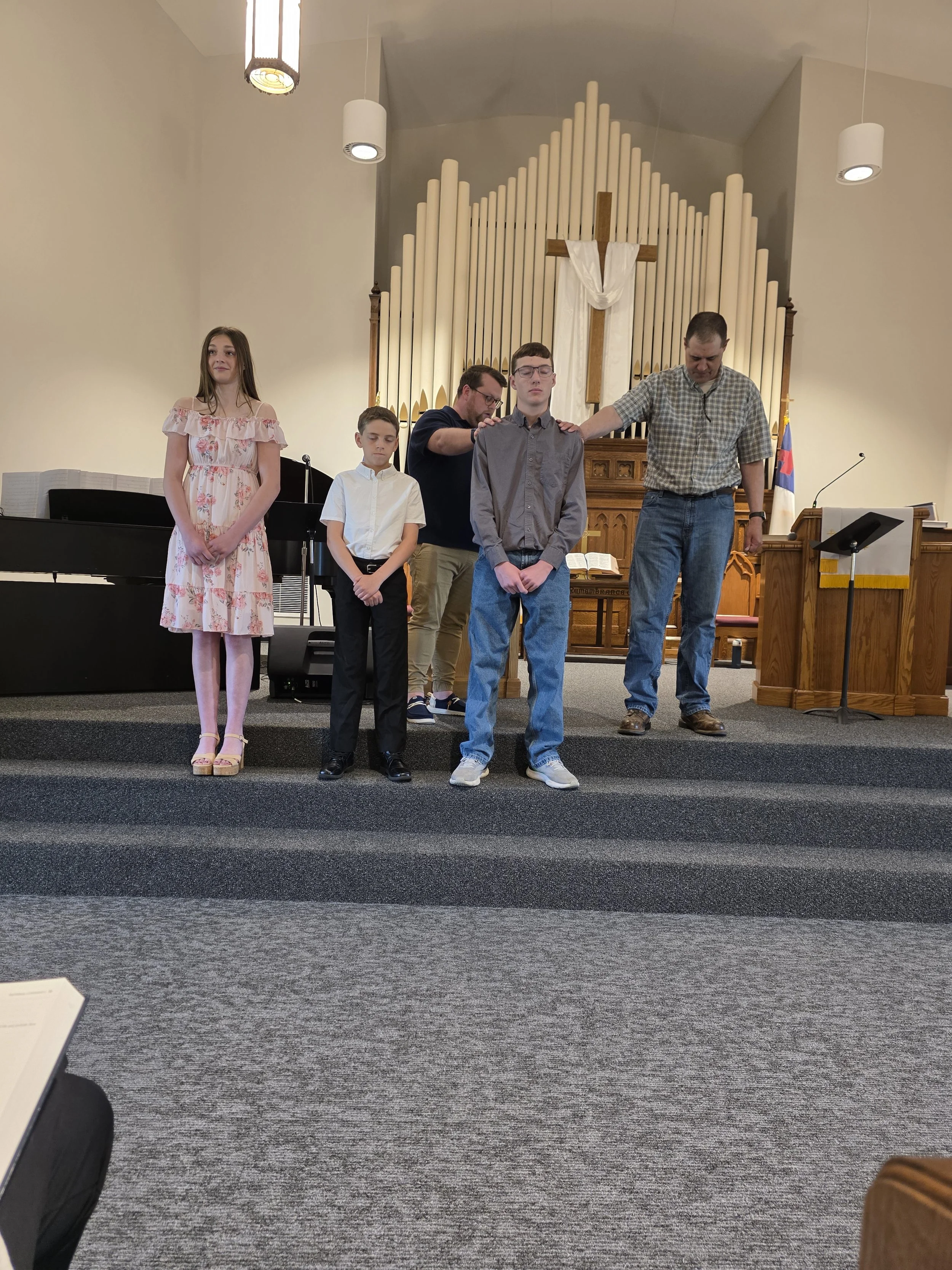 Youth receiving prayer during confirmation at Lexington First United Methodist Church in Lexington, Illinois.