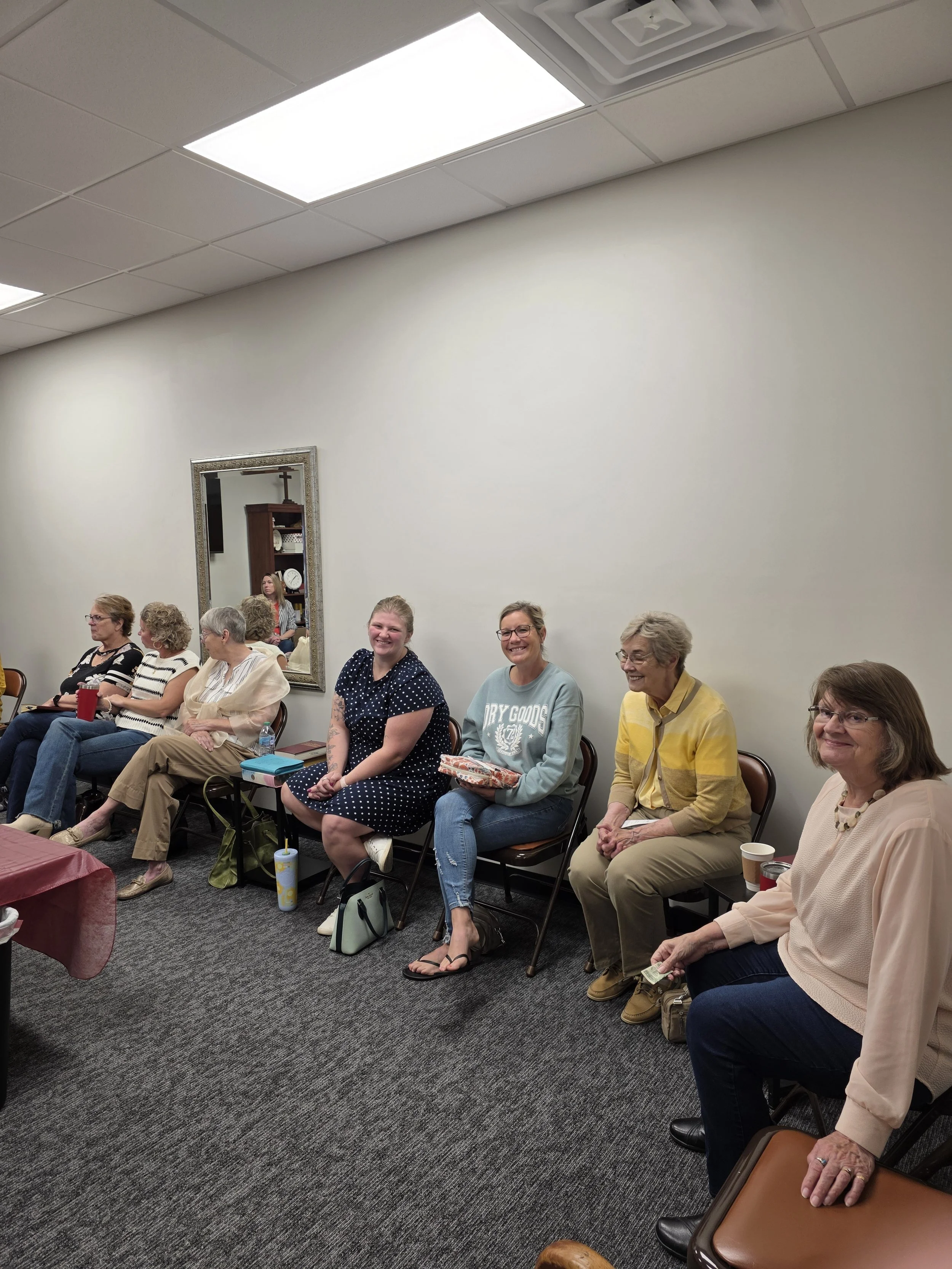 Women from Lexington First United Methodist Church smiling together during Sunday School in Lexington, Illinois.