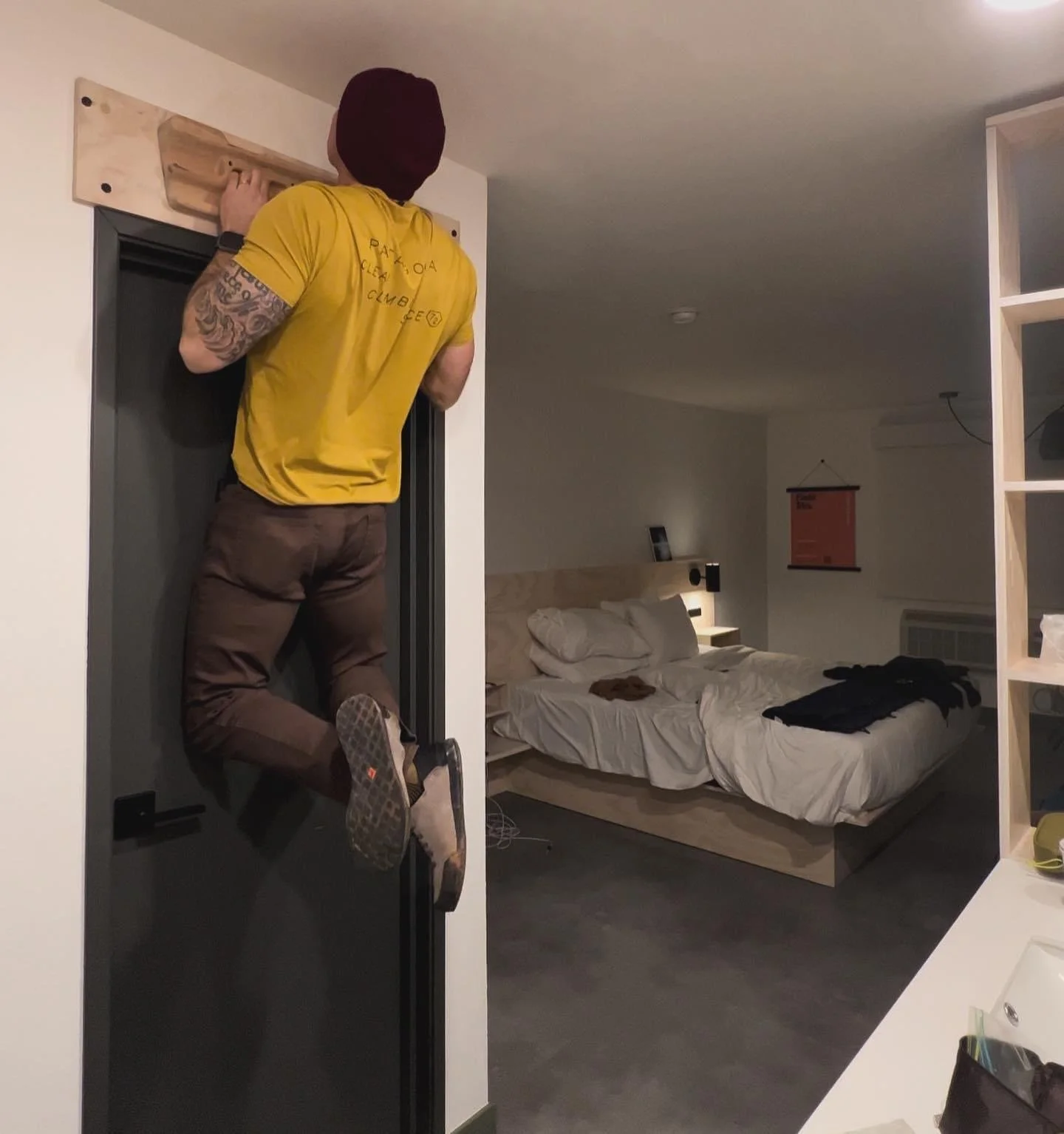 Man doing pull up on bar in FieldStation Moab Hotel