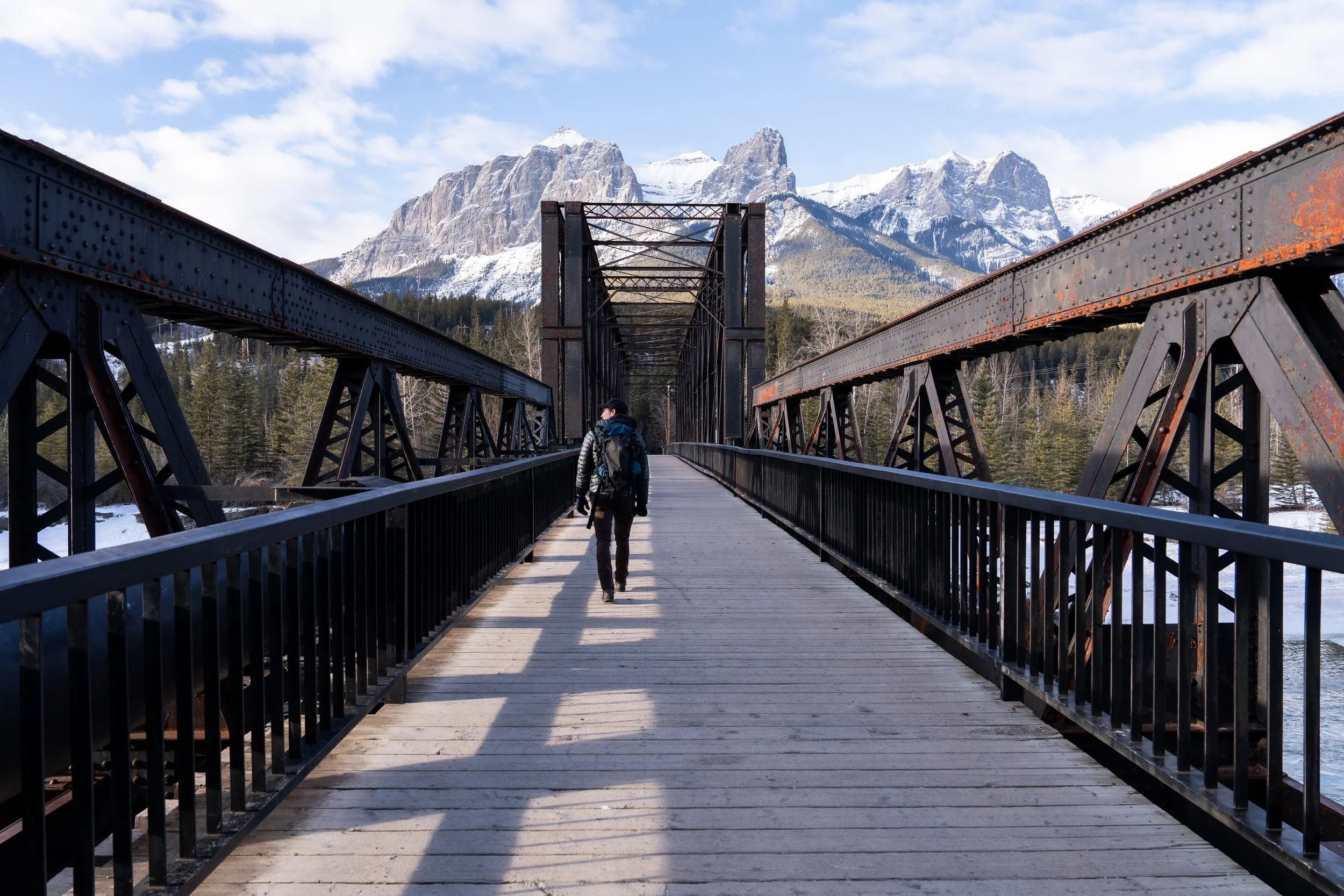 Man walking on Canmore Engine Bridge