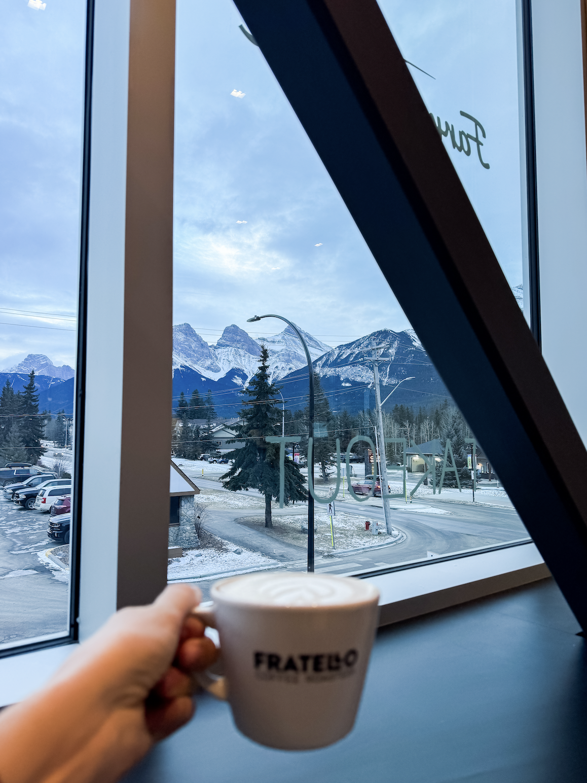 Woman drinking coffee in Canmore
