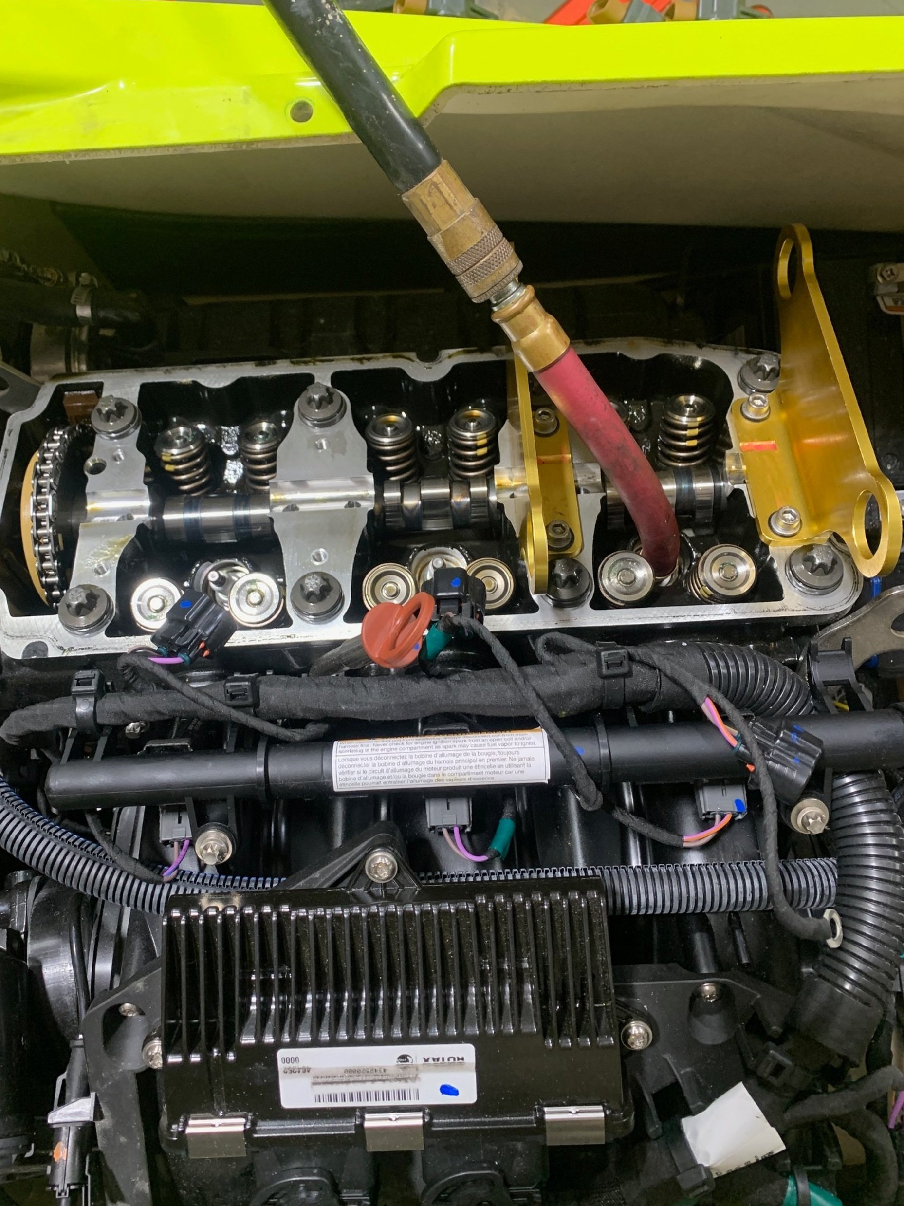 Close-up view of an internal engine component, showing parts of the cylinder head, valves, and supporting mechanical and electrical part performance upgrade ecu parts repair supercharger