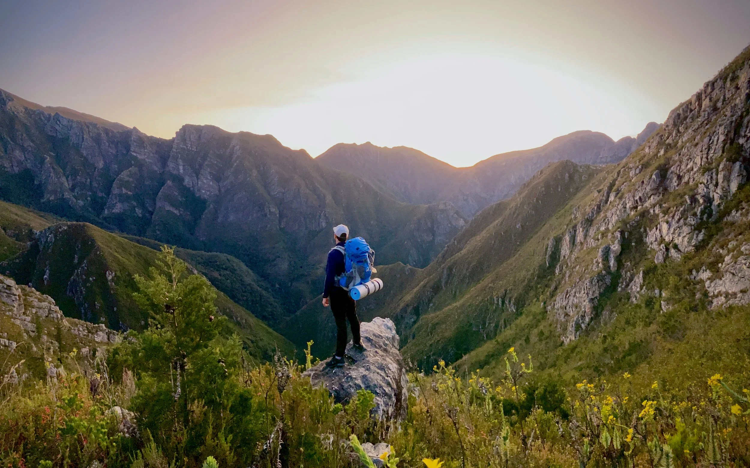 Man on Precipice of Mountain