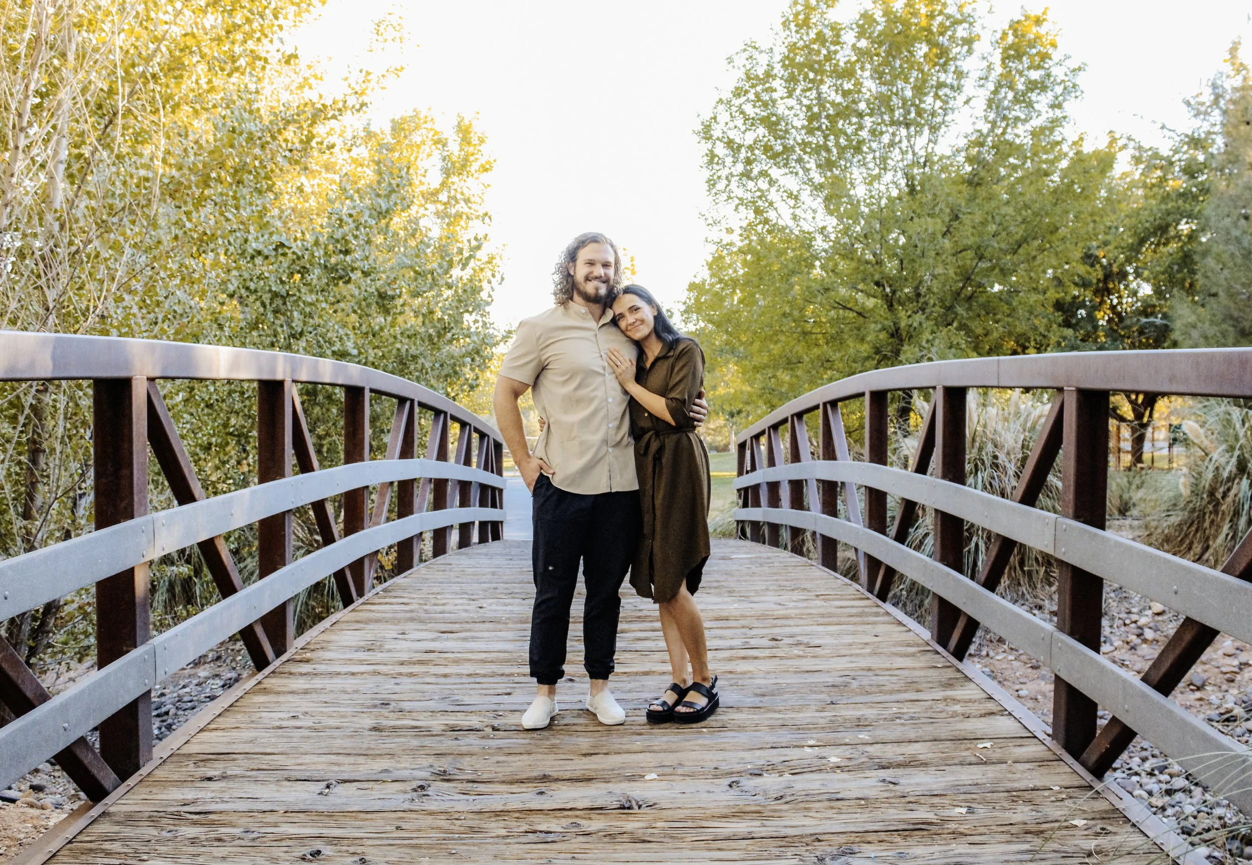 Ammon, personal trainer and his wife standing on a bridge