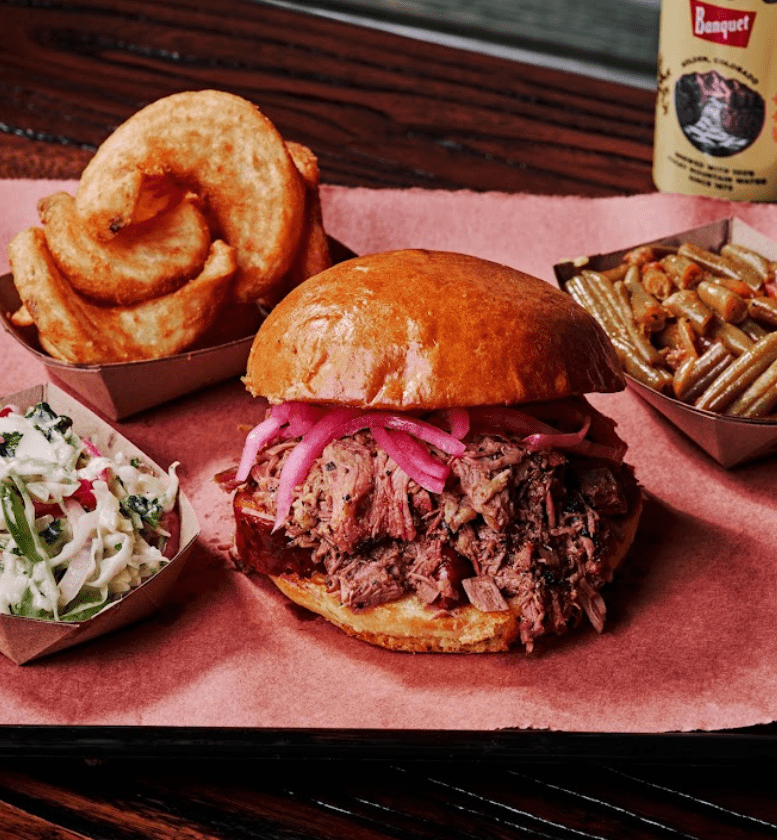 Lewis Barbecue Chopped Brisket sandwich with signature sides