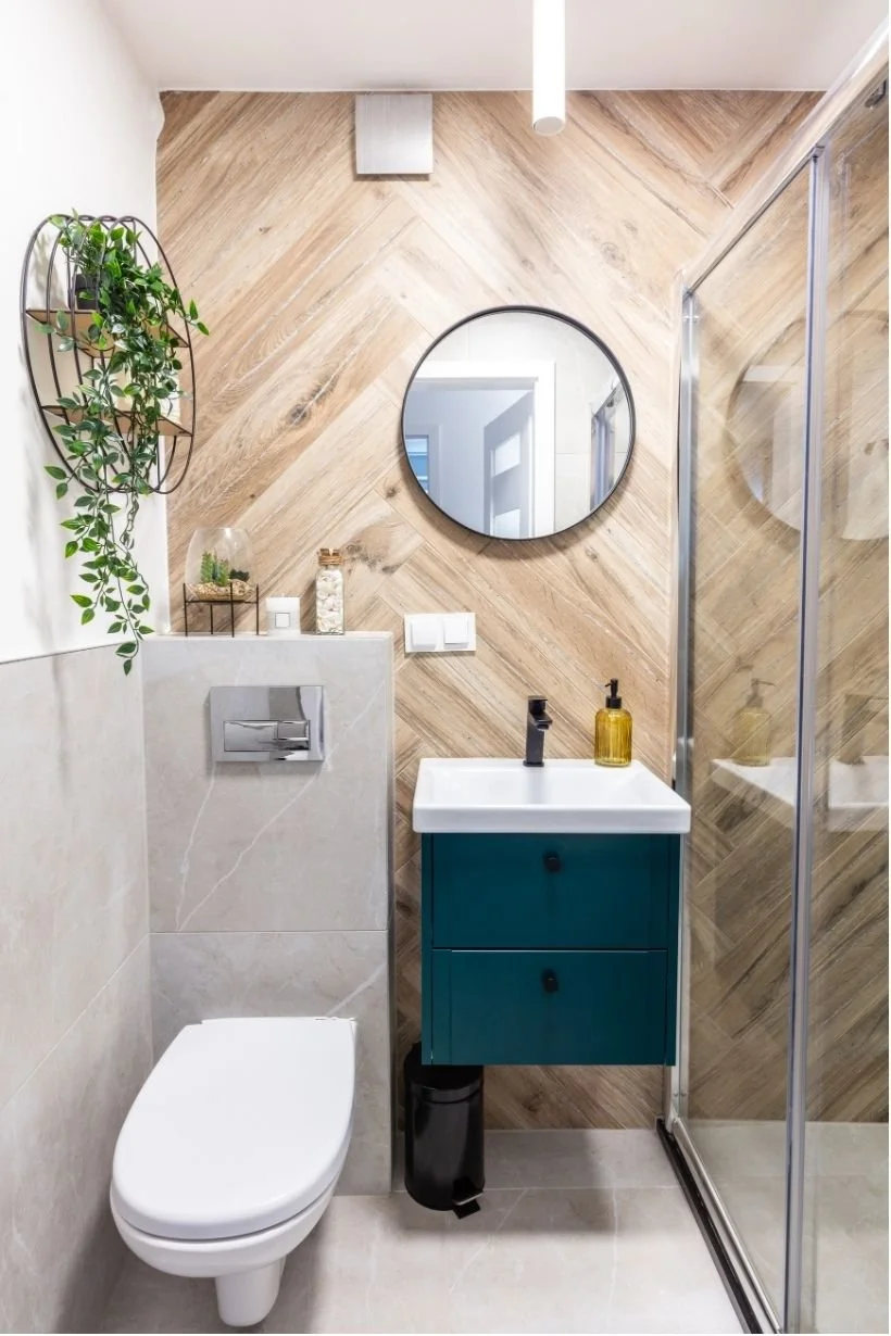 Small bathroom remodel idea with natural wooden and stone accent colors.