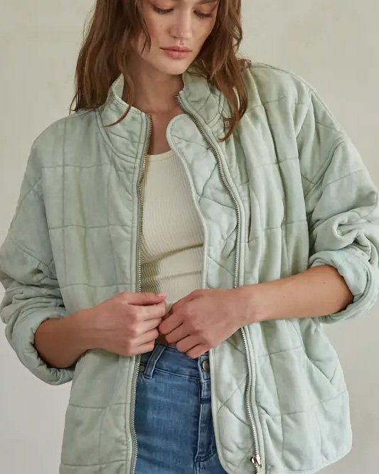 Woman wearing a mint By Together Long Sleeve Quilted Knit Mineral Washed Jacket