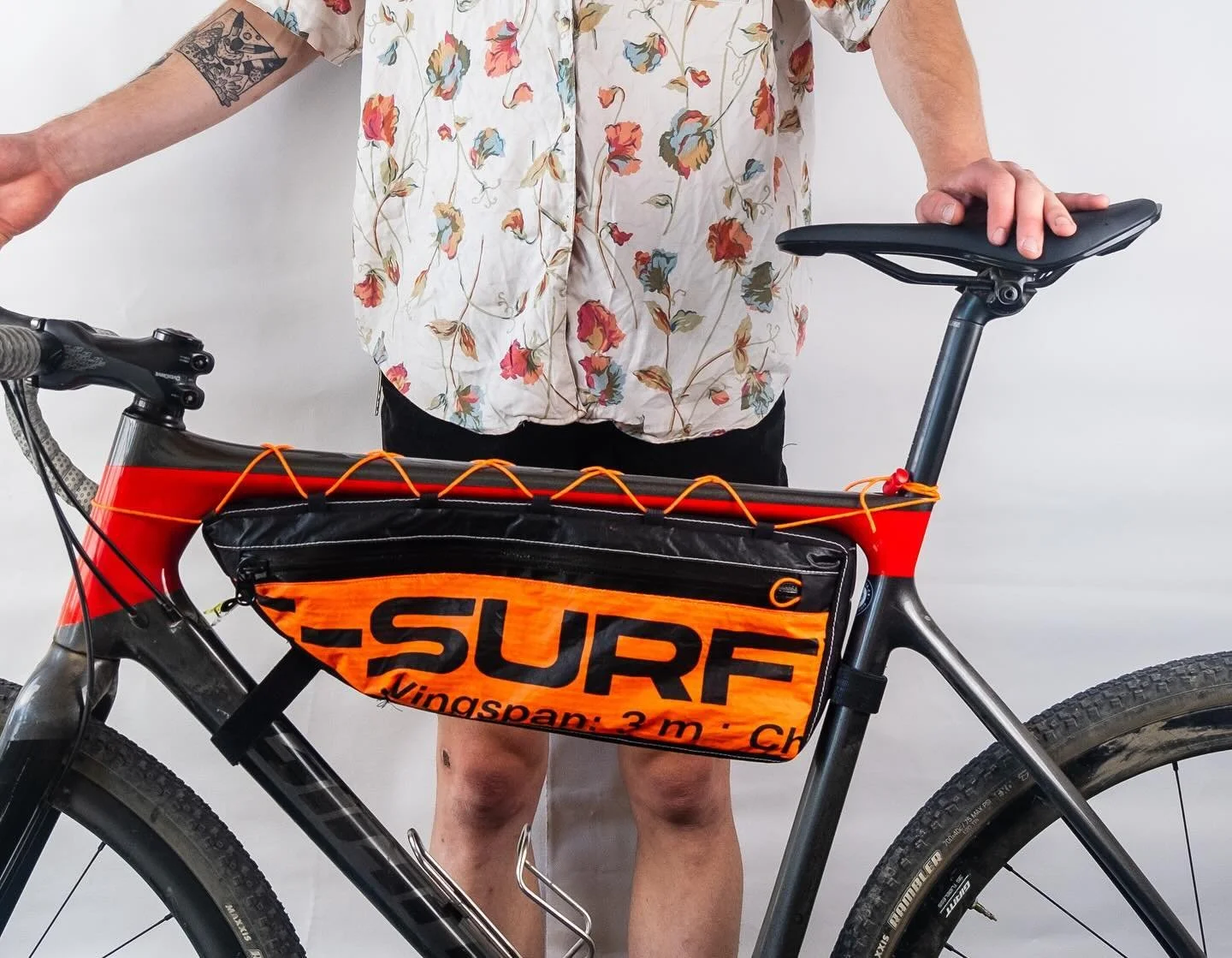 Half frame bag made from an upcycled wing foil sail. My friend got a new sail, so to give the old one new life I made him a bike bag