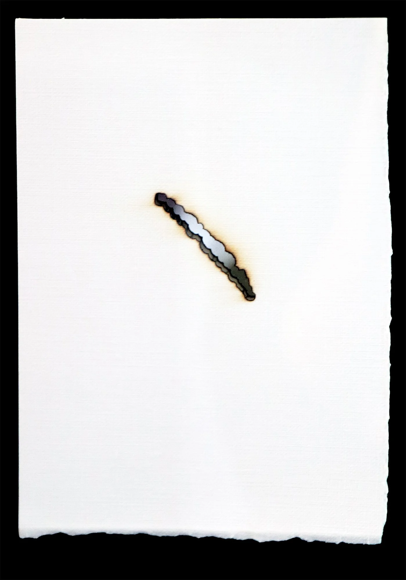 Starlight Drawings (2026)
Watercolor Paper, Mylar.
Paper burned by focused starlight (light of the sun) passing through a handmade spherical lens, marking the time and travel of the sun as it "moves" across the sky. Any gaps in the burning indicate c