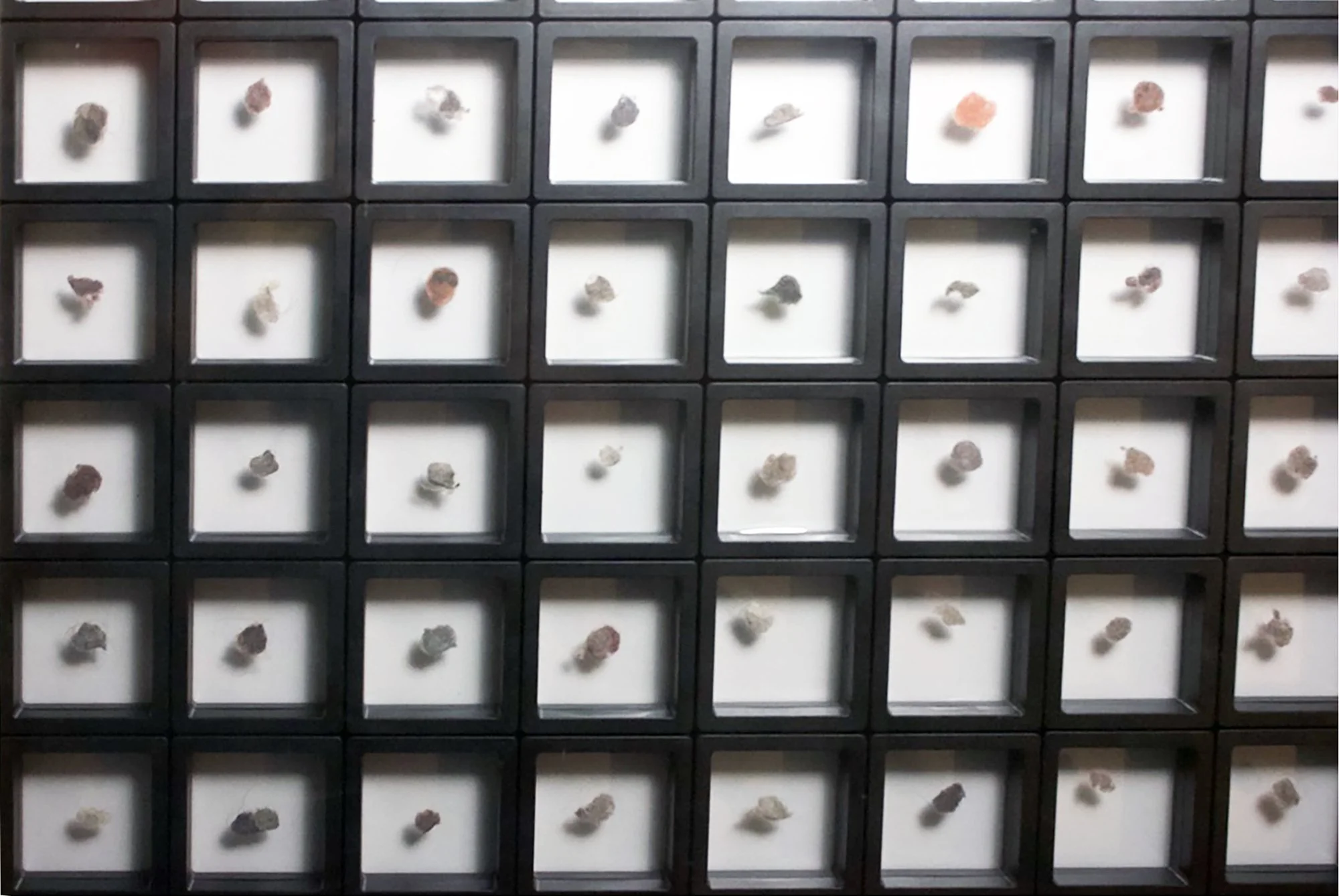 Salstrom Objects: After Messier and his Objects (2025) [DETAIL].
110 collected belly button lints displayed in a manner similar to Charles Messier's catalogue of astronomical objects he discovered.