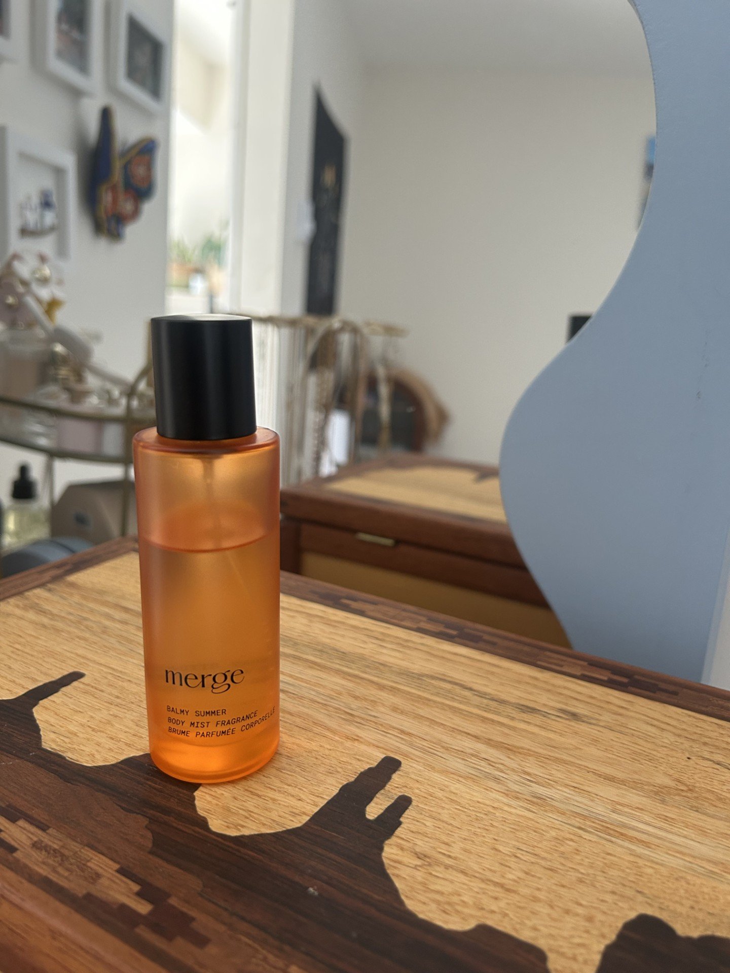 Merge Balmy Summer body mist on walnut