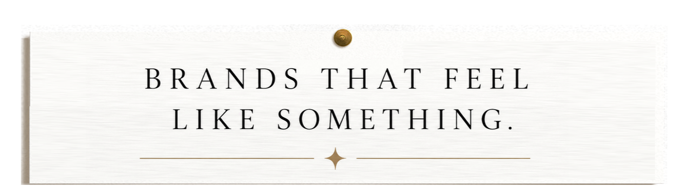 Banner with text 'Brands that feel like something.' on a white background with a gold star and line design.