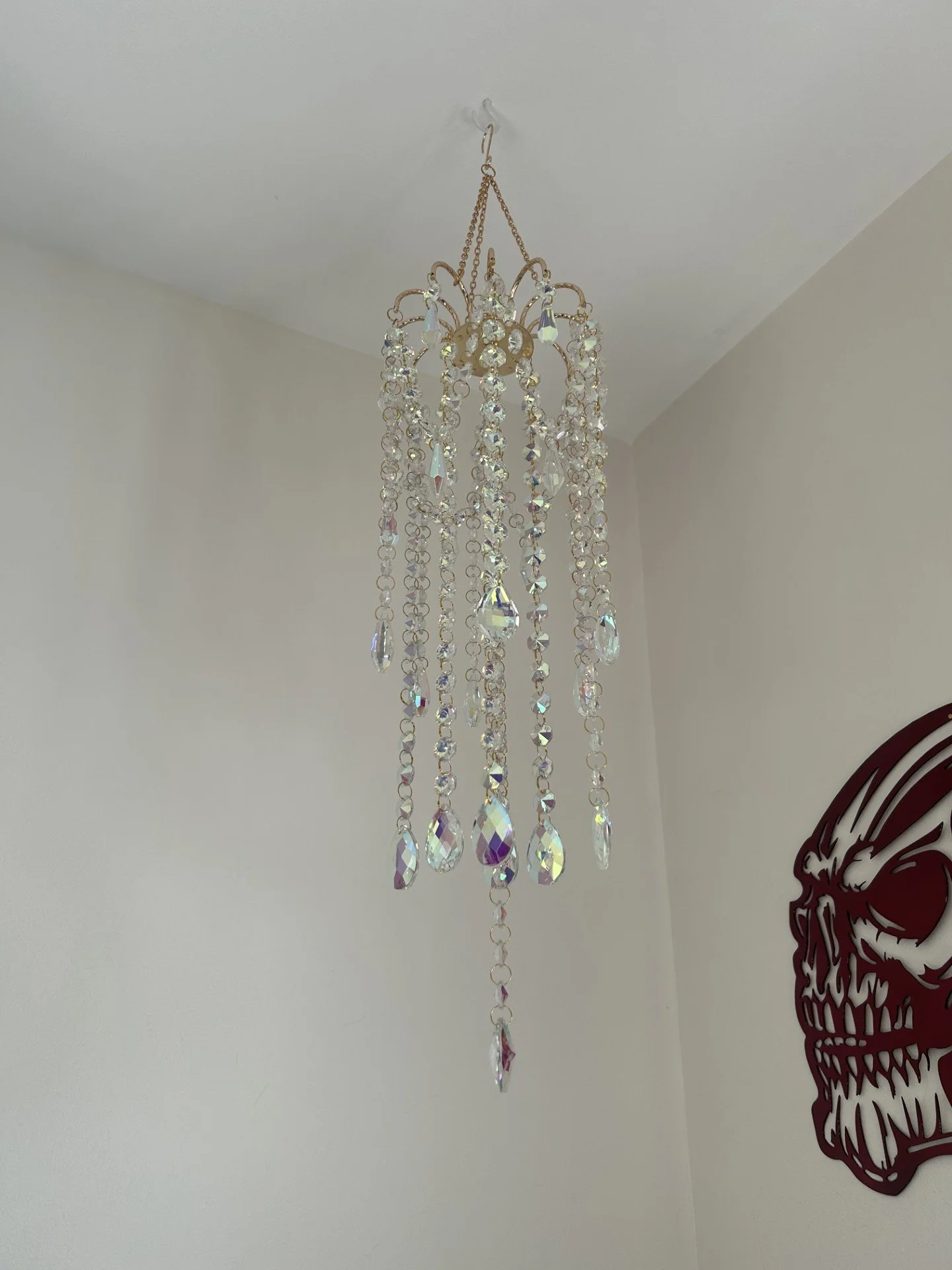 Faceted crystal mobile catching light