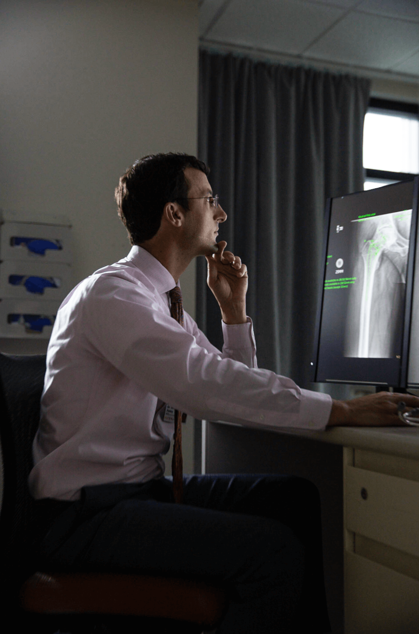 work_healthcare-orthopedic-doctor-with-xrays-2.png